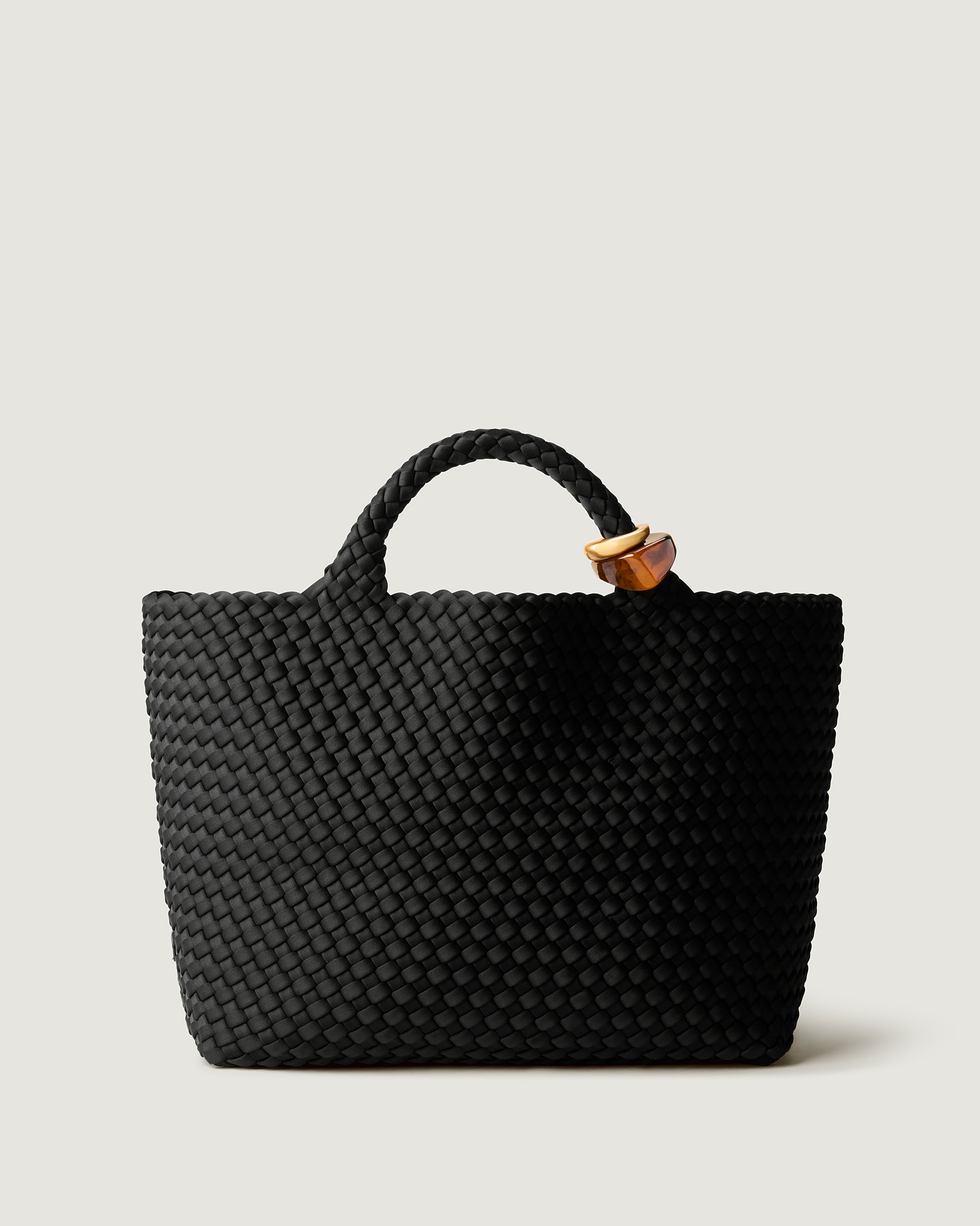 St. Barths Tote in Onyx, a true black tone, in handwoven neoprene, featuring an open top, and beads on front handle.