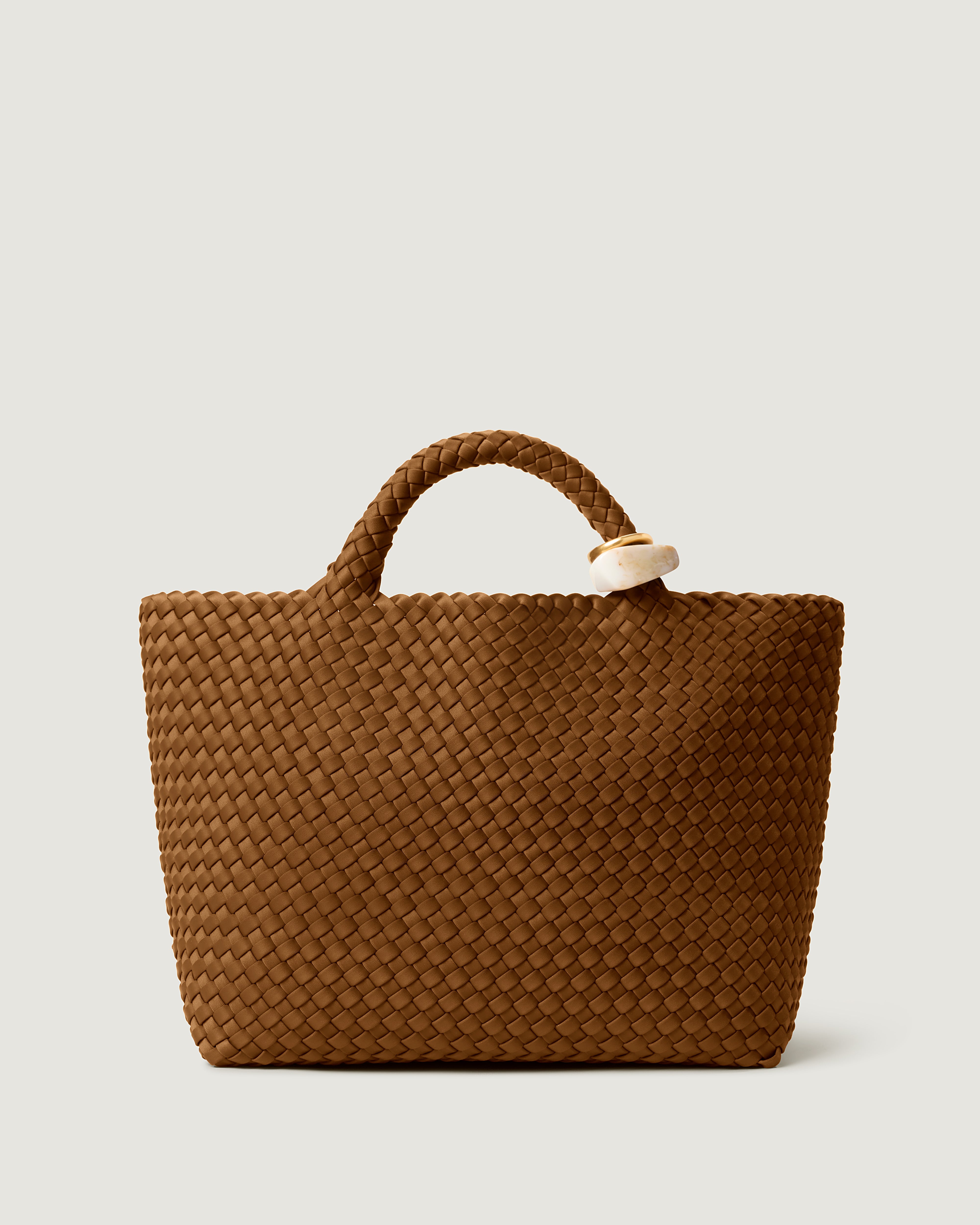 St. Barths Tote in Teak, a saddle brown tone, in handwoven neoprene, featuring an open top and beads on front handle.