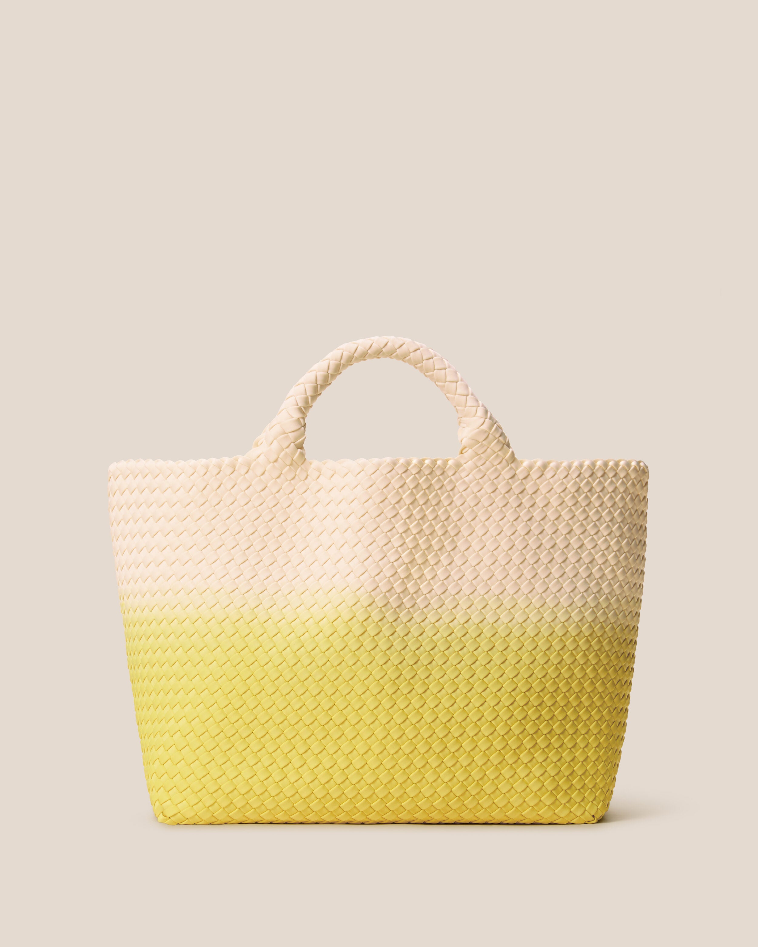 St. Barths Tote in Ginkgo, a bone and yellow tone, in handwoven neoprene, featuring an open top, and woven top handles.