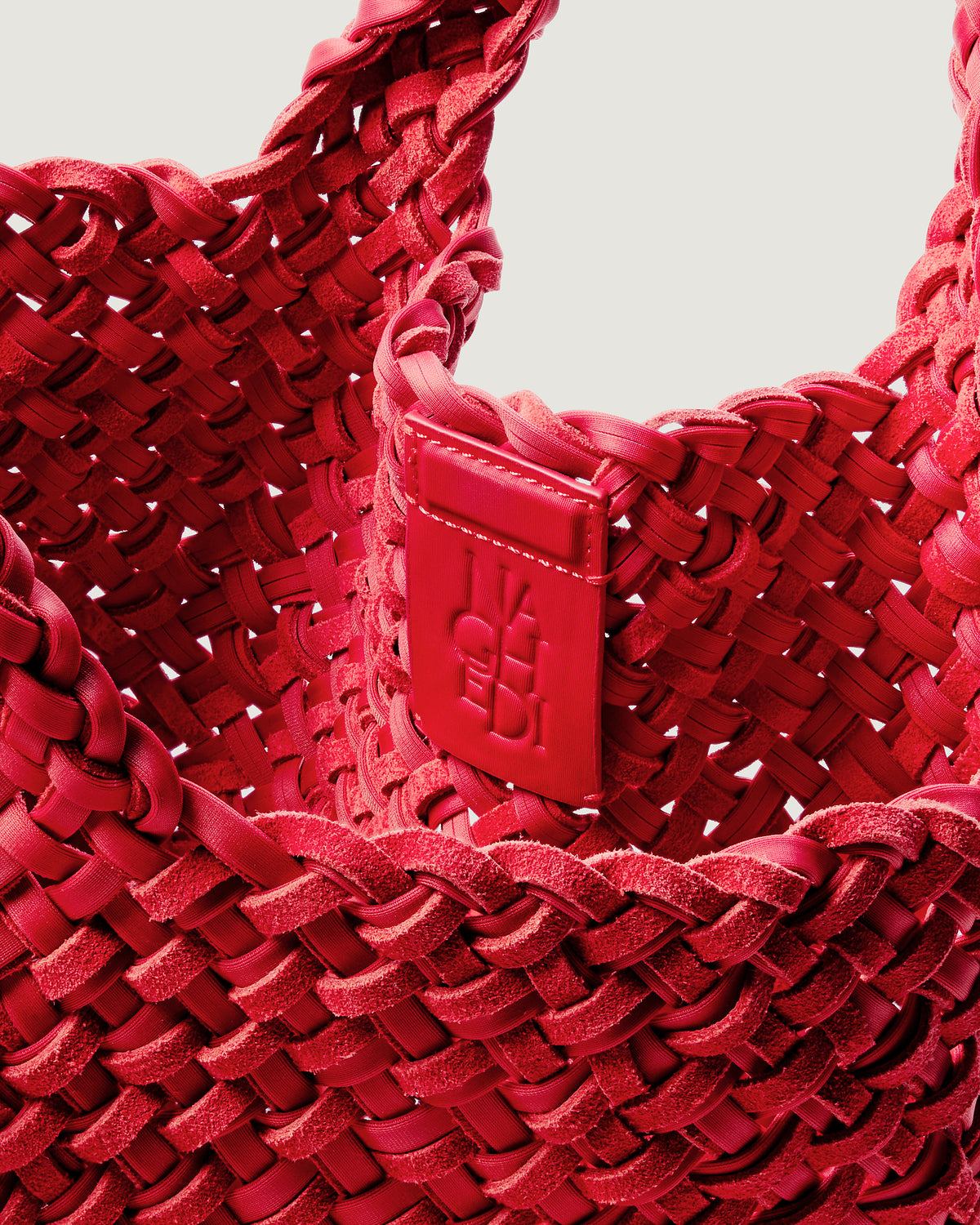 Interior close-up of St. Barths Tote in Cerise showing its open top, magnetic closure, and unlined interior.