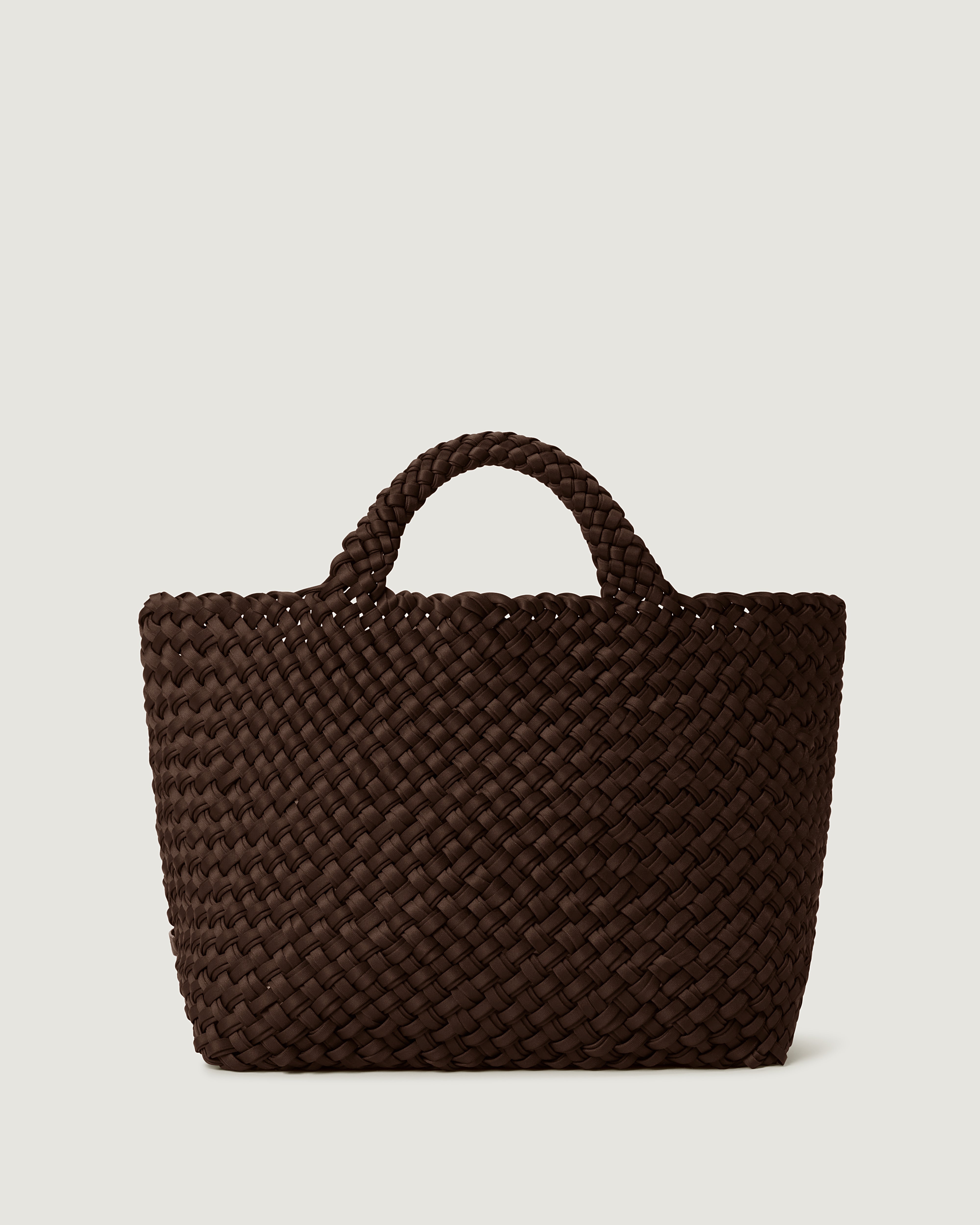 St. Barths Tote in Chocolate, handwoven from doubled strands of dark drown neoprene. Featuring an open top and woven handles.