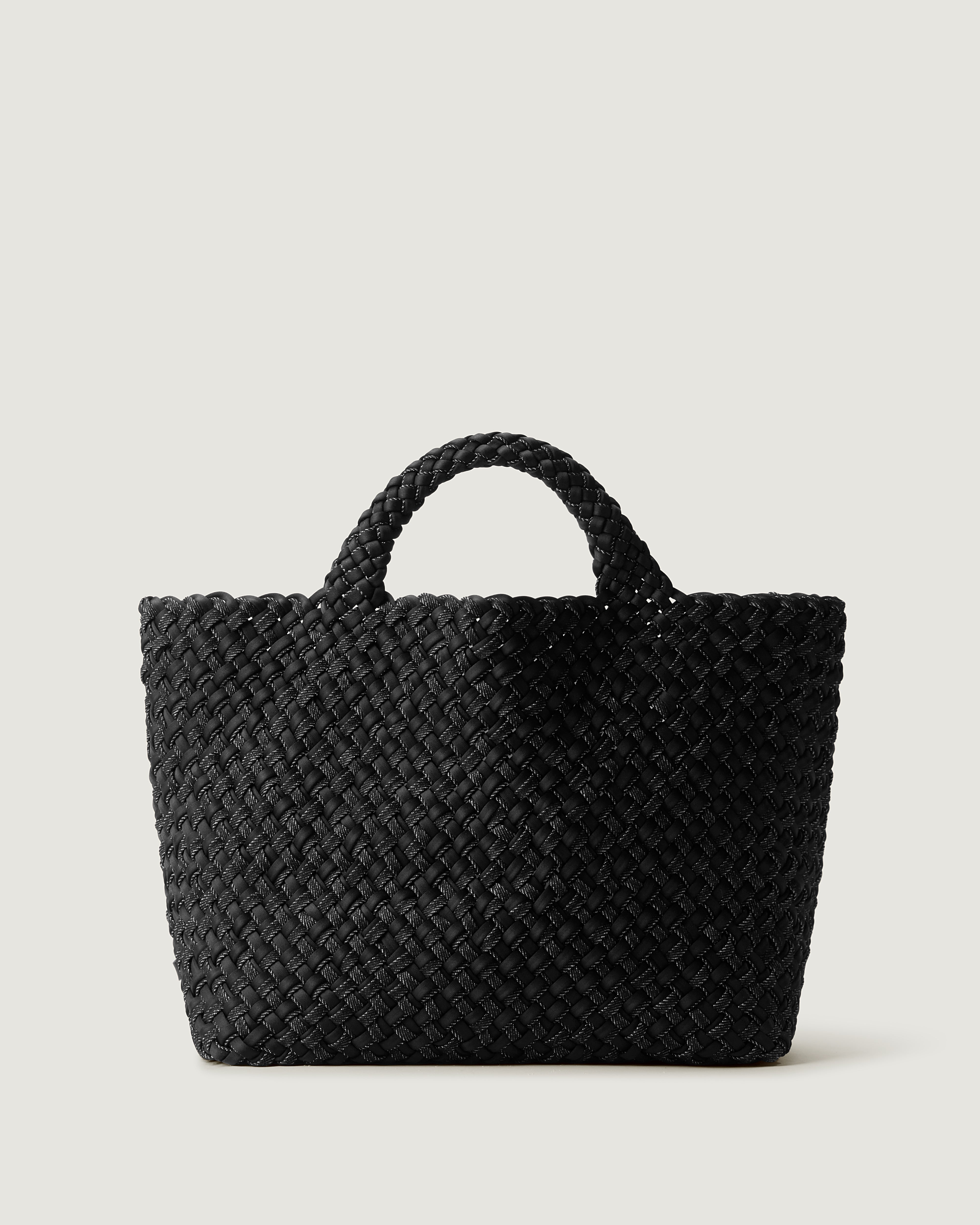 St. Barths Tote in Jet, handwoven in black neoprene with black denim. Featuring an open top, and woven top handles.