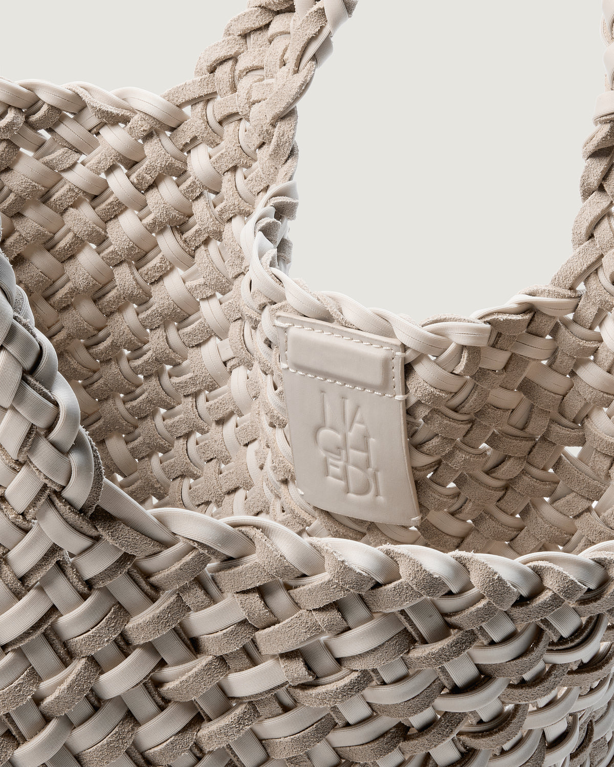 Interior close-up of St. Barths Tote in Linen showing its open top, magnetic closure, and unlined interior.