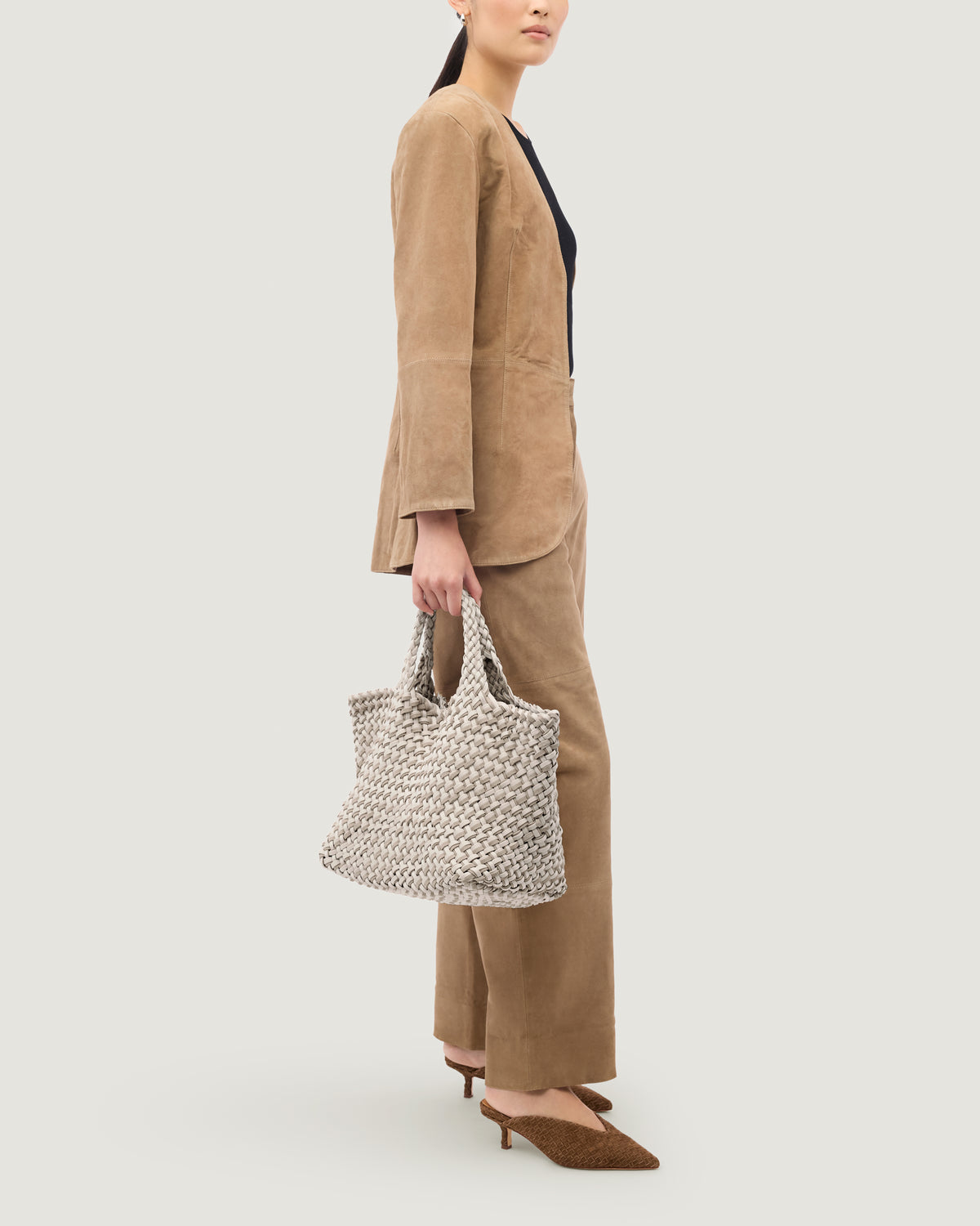 St. Barths Tote in Linen shown on model to illustrate scale and soft silhouette.