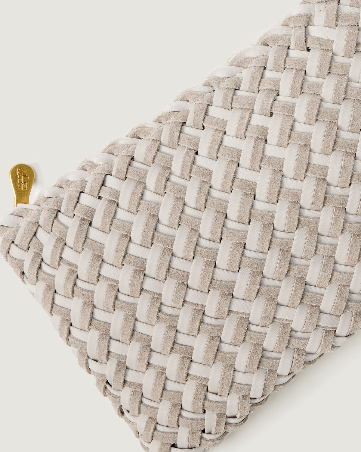 Close-up of included matching woven suede and neoprene zippered pouch.