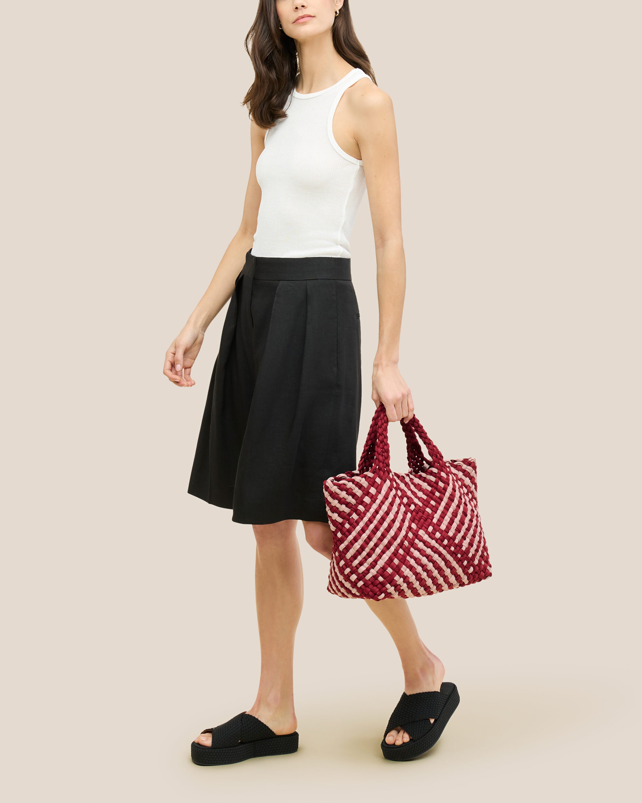 St. Barths Tote in Lychee shown on model to illustrate scale and soft silhouette.