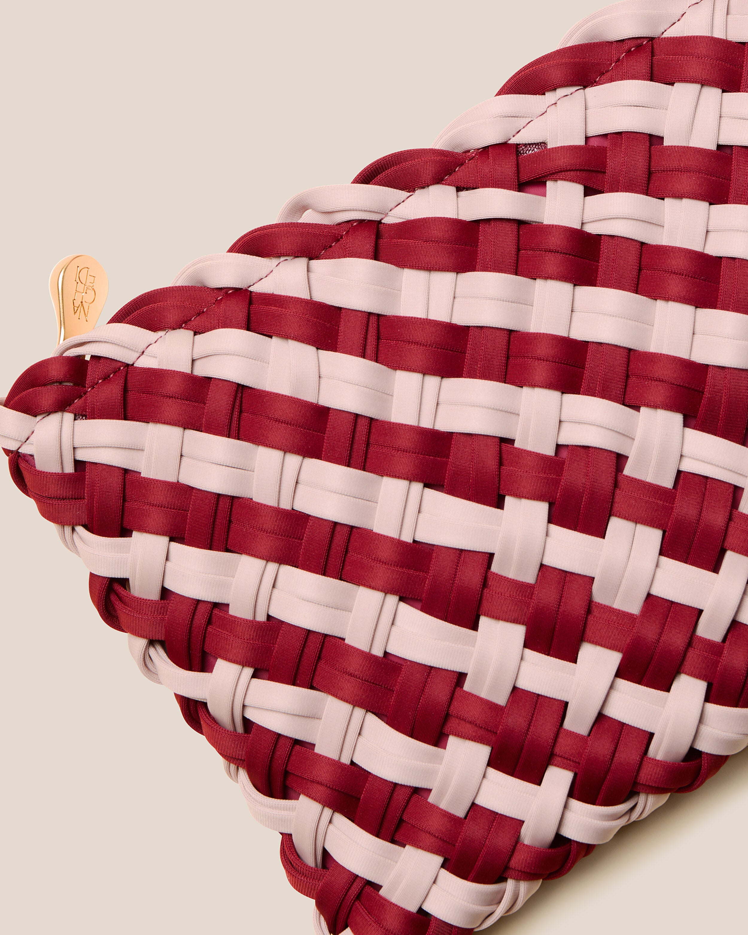 Close-up of included matching woven zippered pouch.