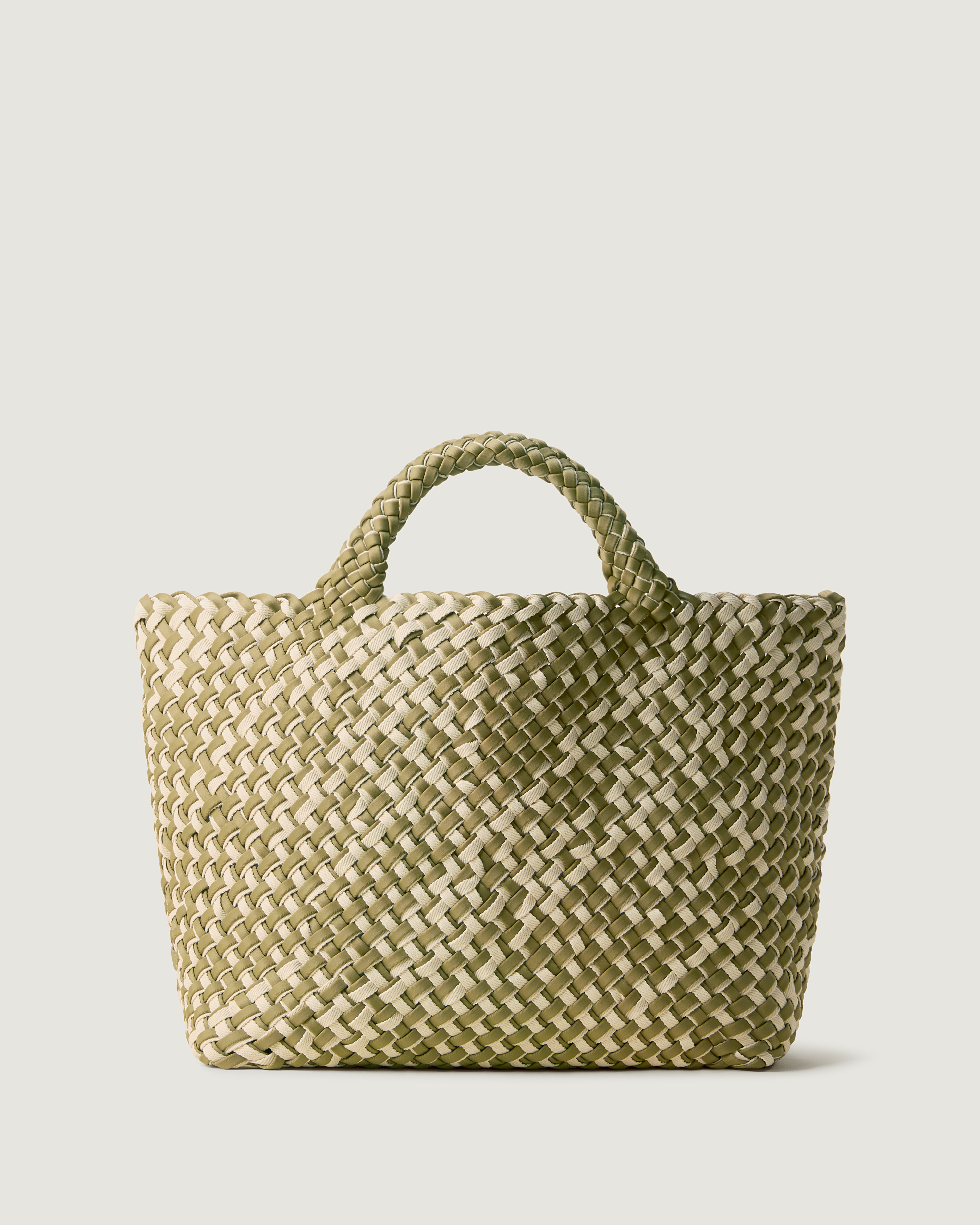 St. Barths Tote in Oletta, handwoven in muted bottle green neoprene with cream cotton. Featuring an open top, and woven top handles.