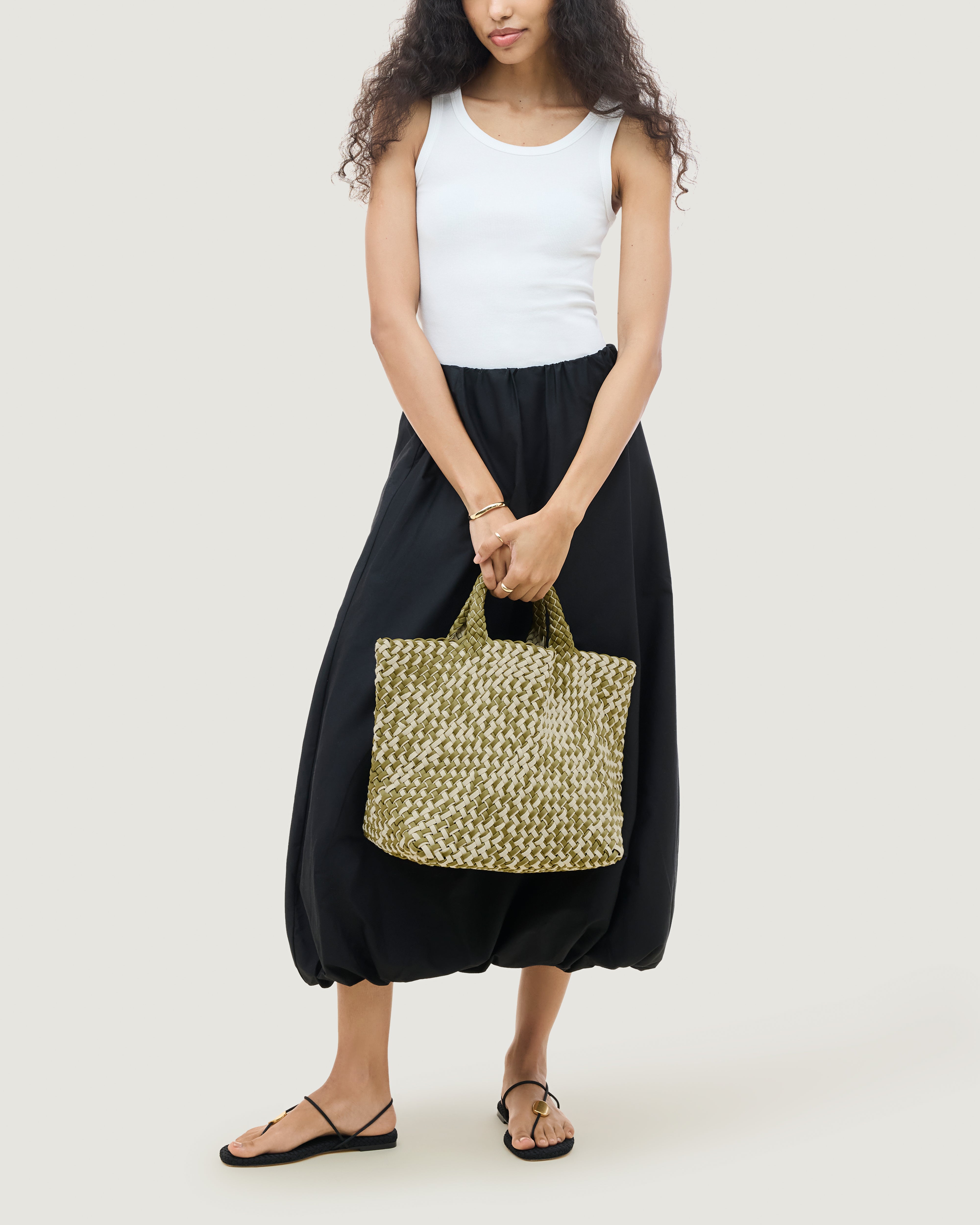 St. Barths Tote in Oletta shown on model to illustrate scale and soft silhouette.
