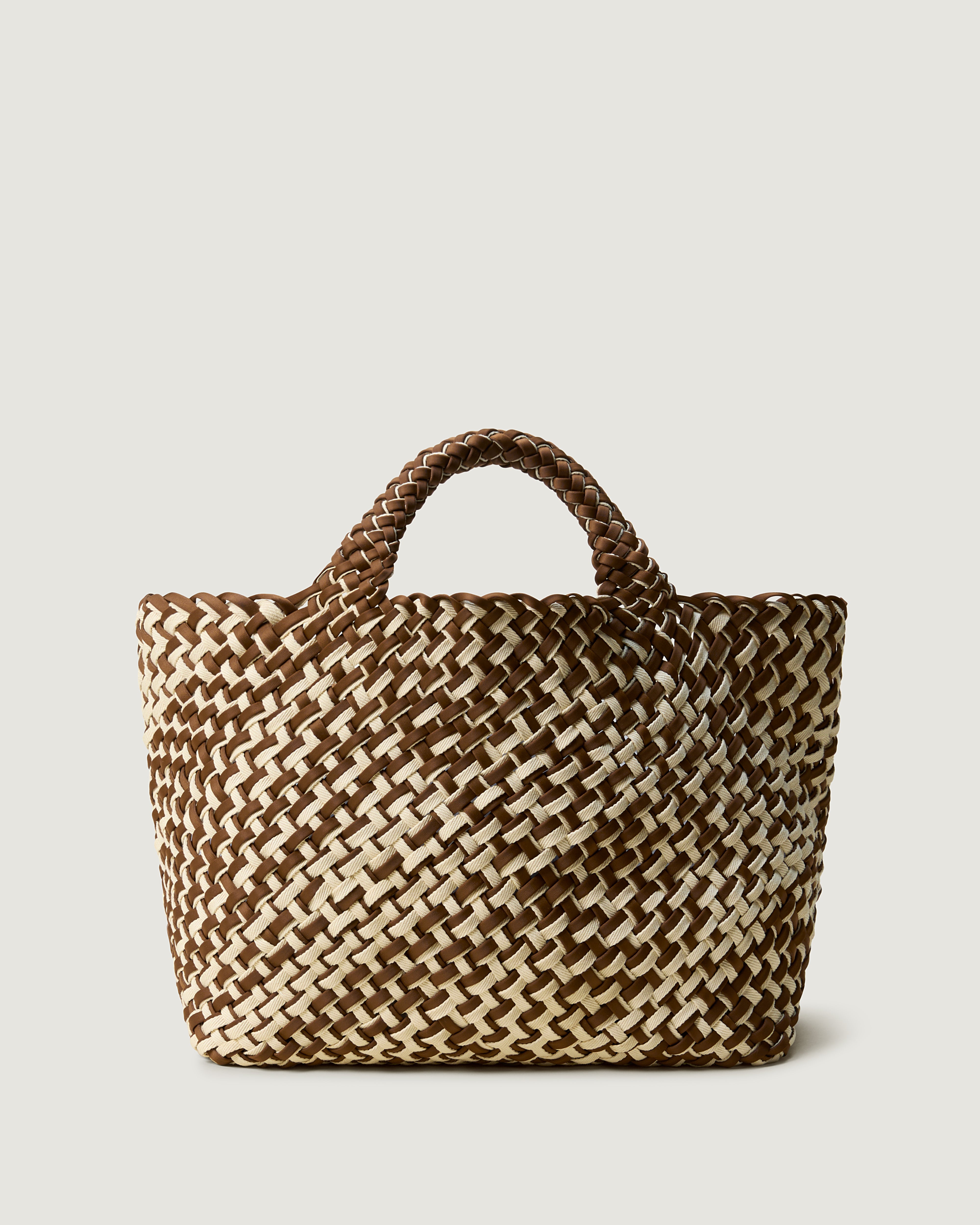 St. Barths Tote in Carmel, handwoven in saddle brown neoprene with cream cottom. Featuring an open top, and woven top handles.
