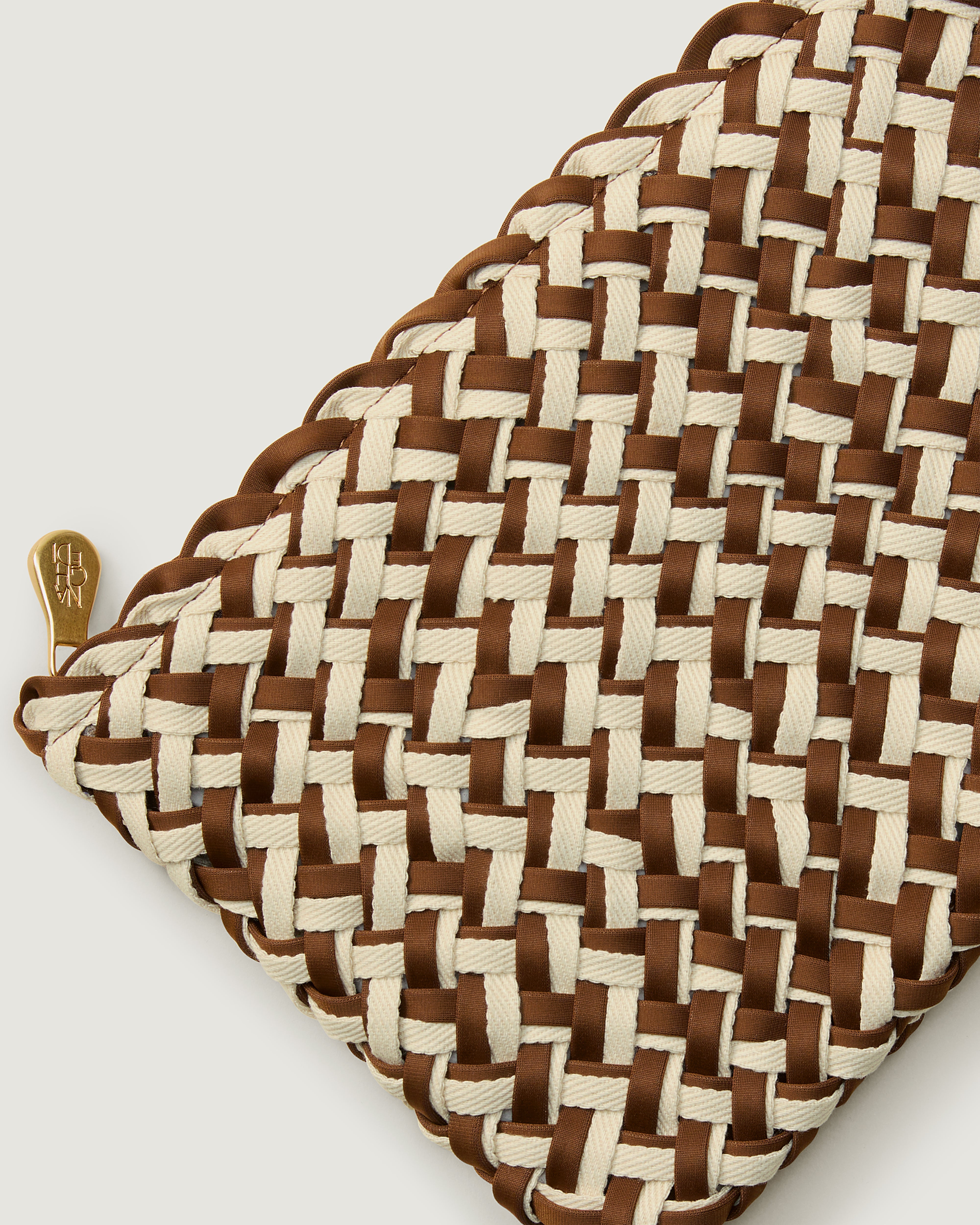 Close-up of included matching woven zippered pouch.