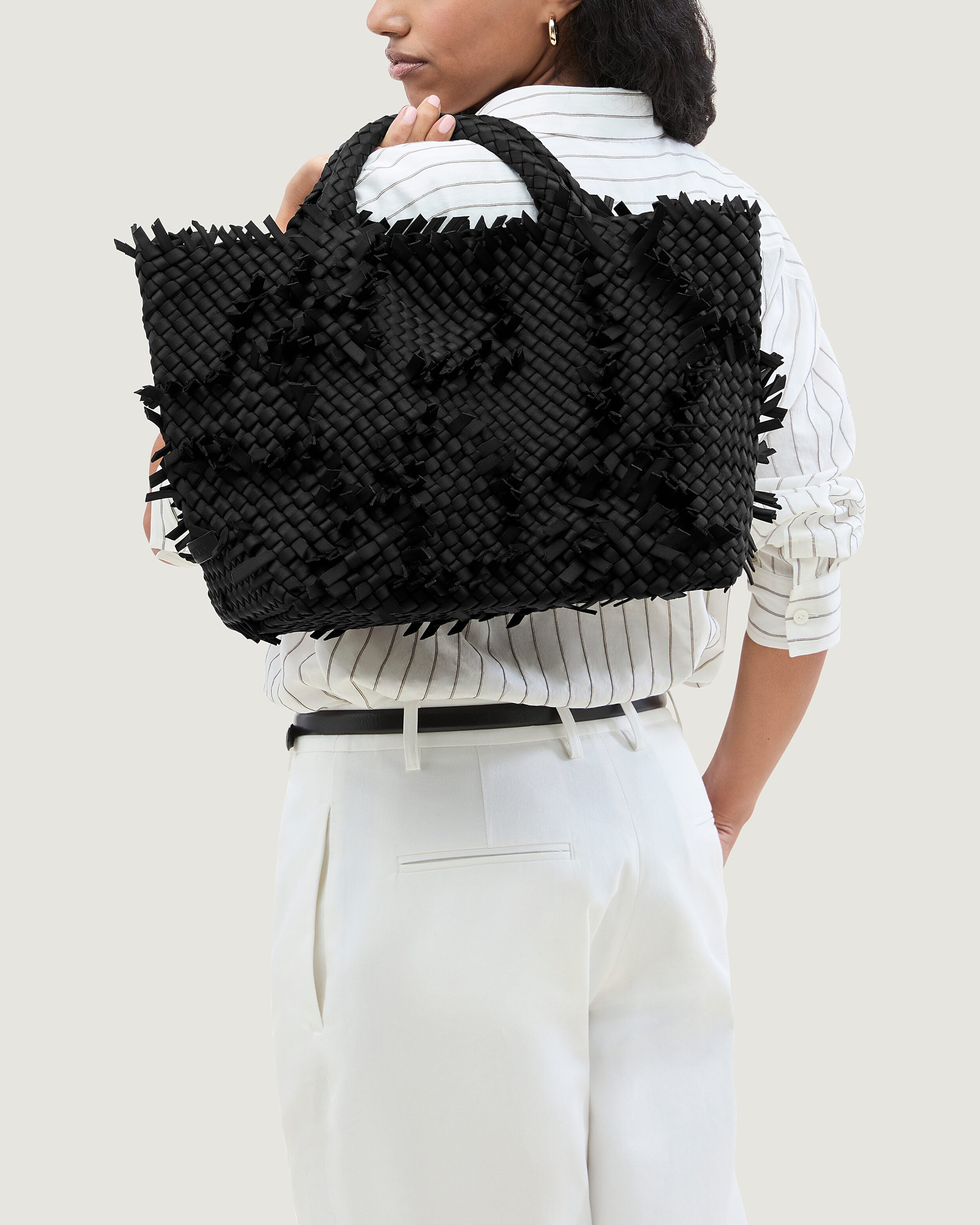 St. Barths Tote in Onyx shown on model to illustrate scale and soft silhouette.