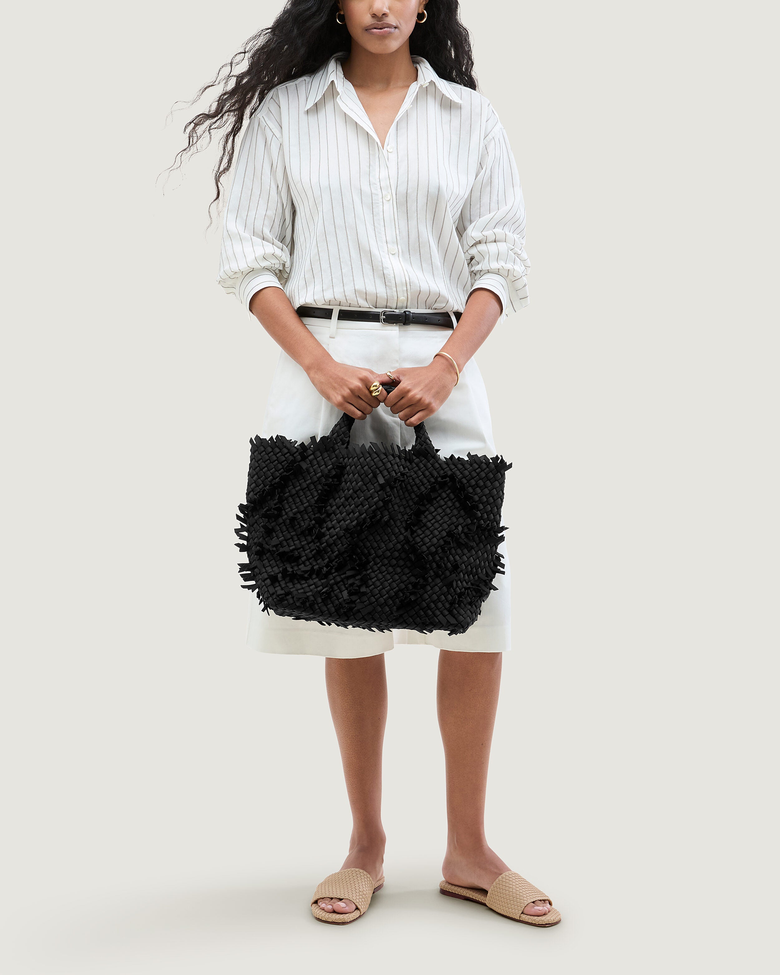 St. Barths Tote in Onyx shown on model to illustrate scale and soft silhouette.