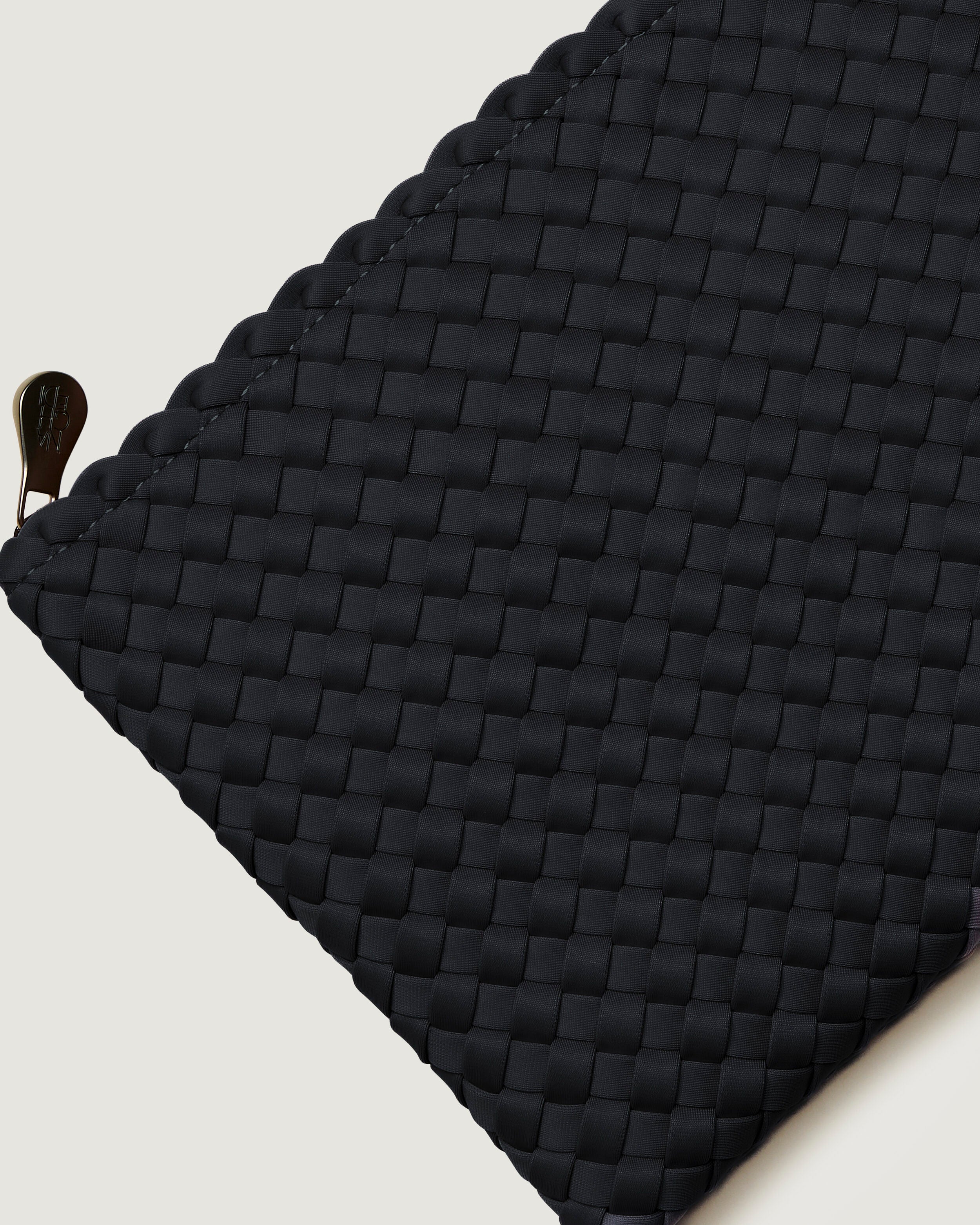 Close-up of included matching woven zippered pouch.