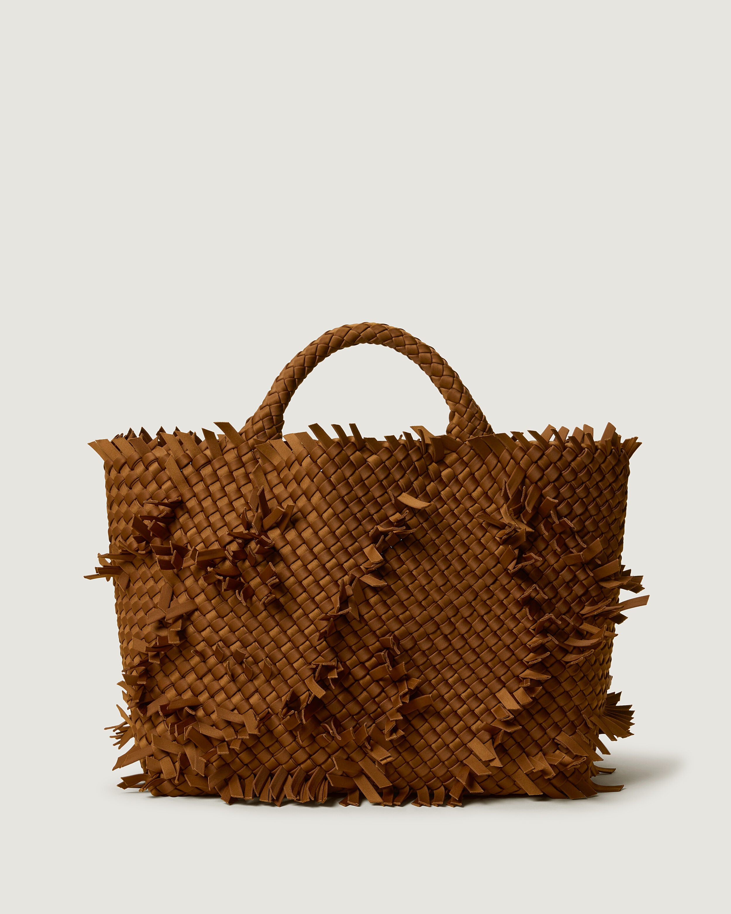 St. Barths Tote in Teak, a saddle brown tone, in handwoven neoprene, featuring an open top, and woven top handles.