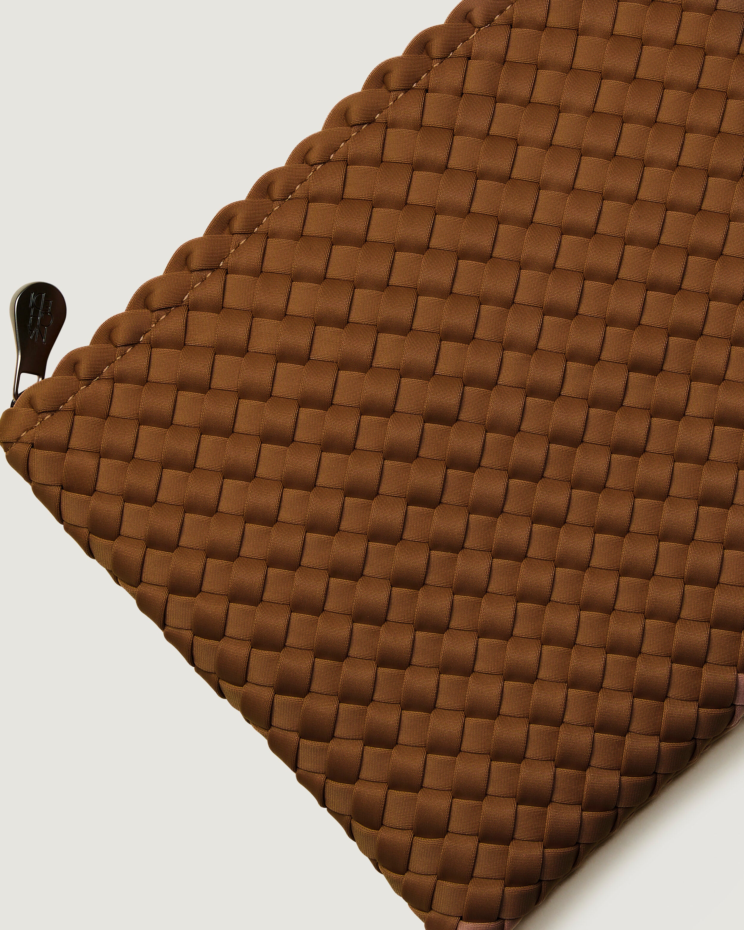 Close-up of included matching woven zippered pouch.