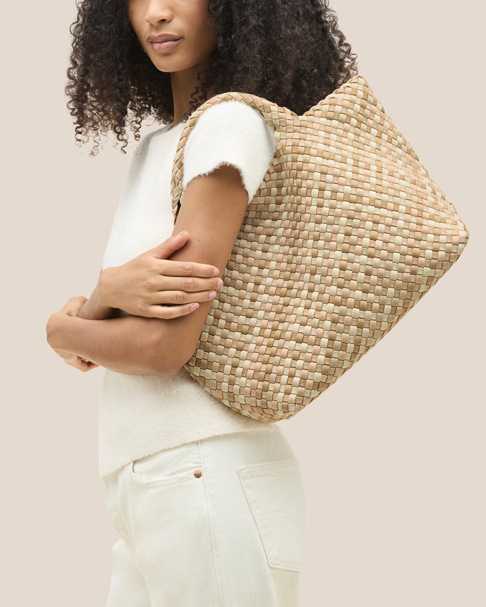 St. Barths Tote in Lanai shown on model to illustrate scale and soft silhouette.