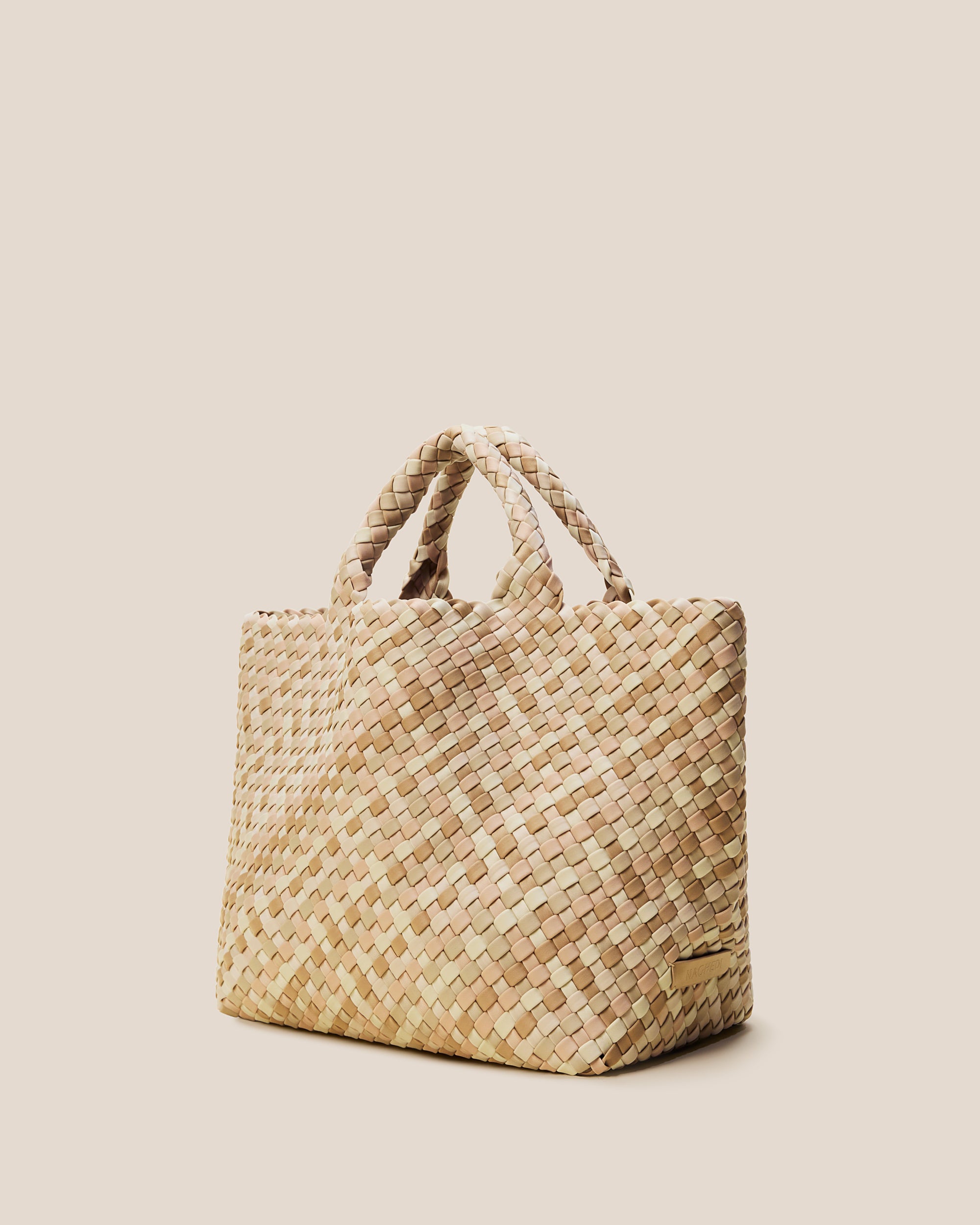 St. Barths Tote in Lanai shown from a side angle, highlighting its handwoven neoprene construction and open top.
