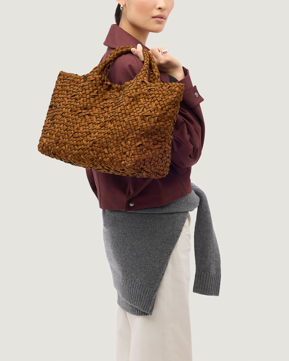 St. Barths Tote in Teak shown on model to illustrate scale and soft silhouette.