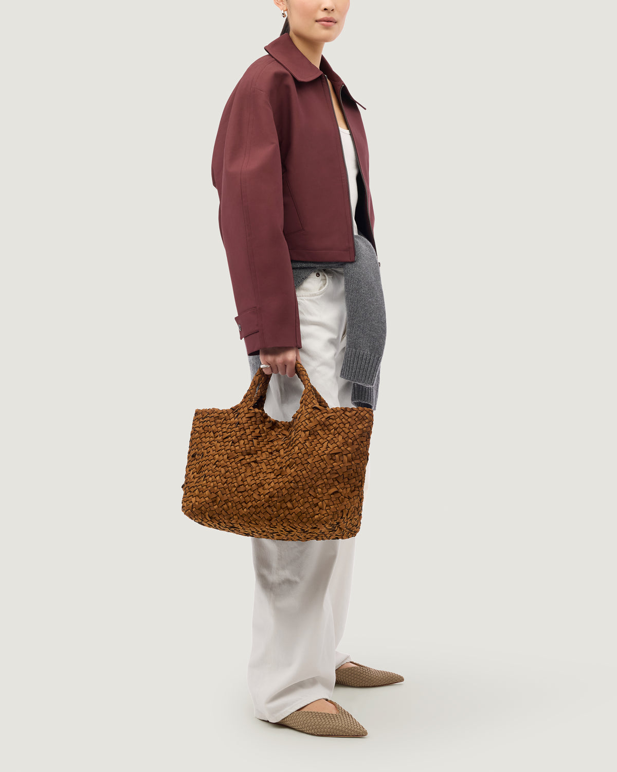 St. Barths Tote in Teak shown on model to illustrate scale and soft silhouette.