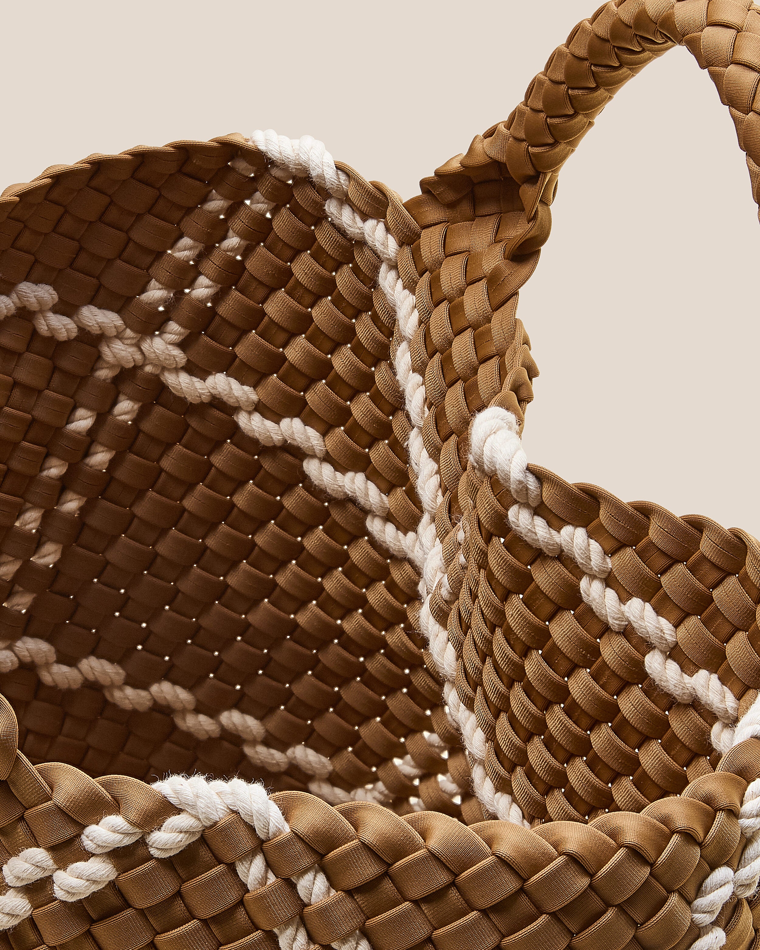 Interior close-up of St. Barths Tote in Cove showing its open top, and unlined interior.