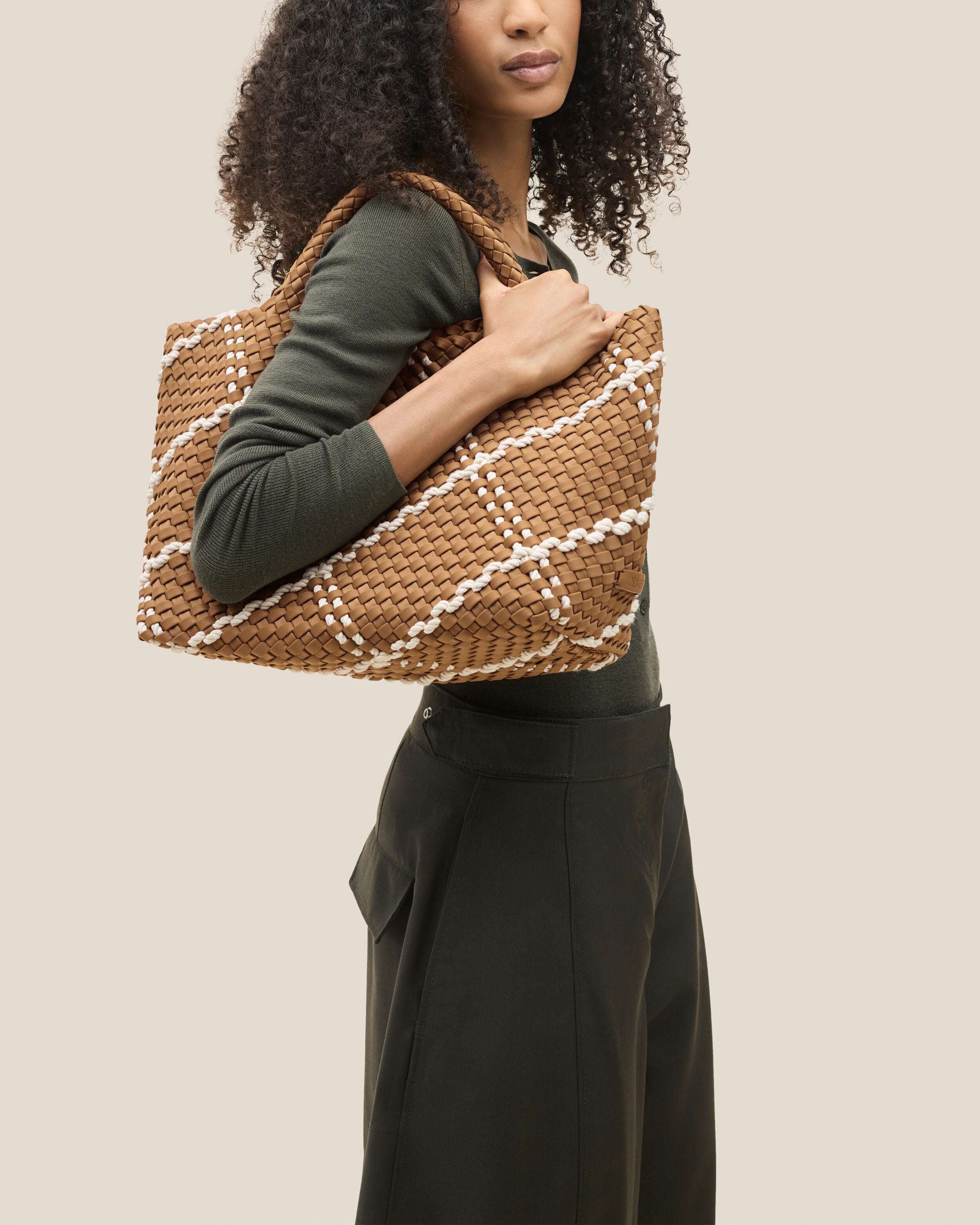 St. Barths Tote in Cove shown on model to illustrate scale and soft silhouette.