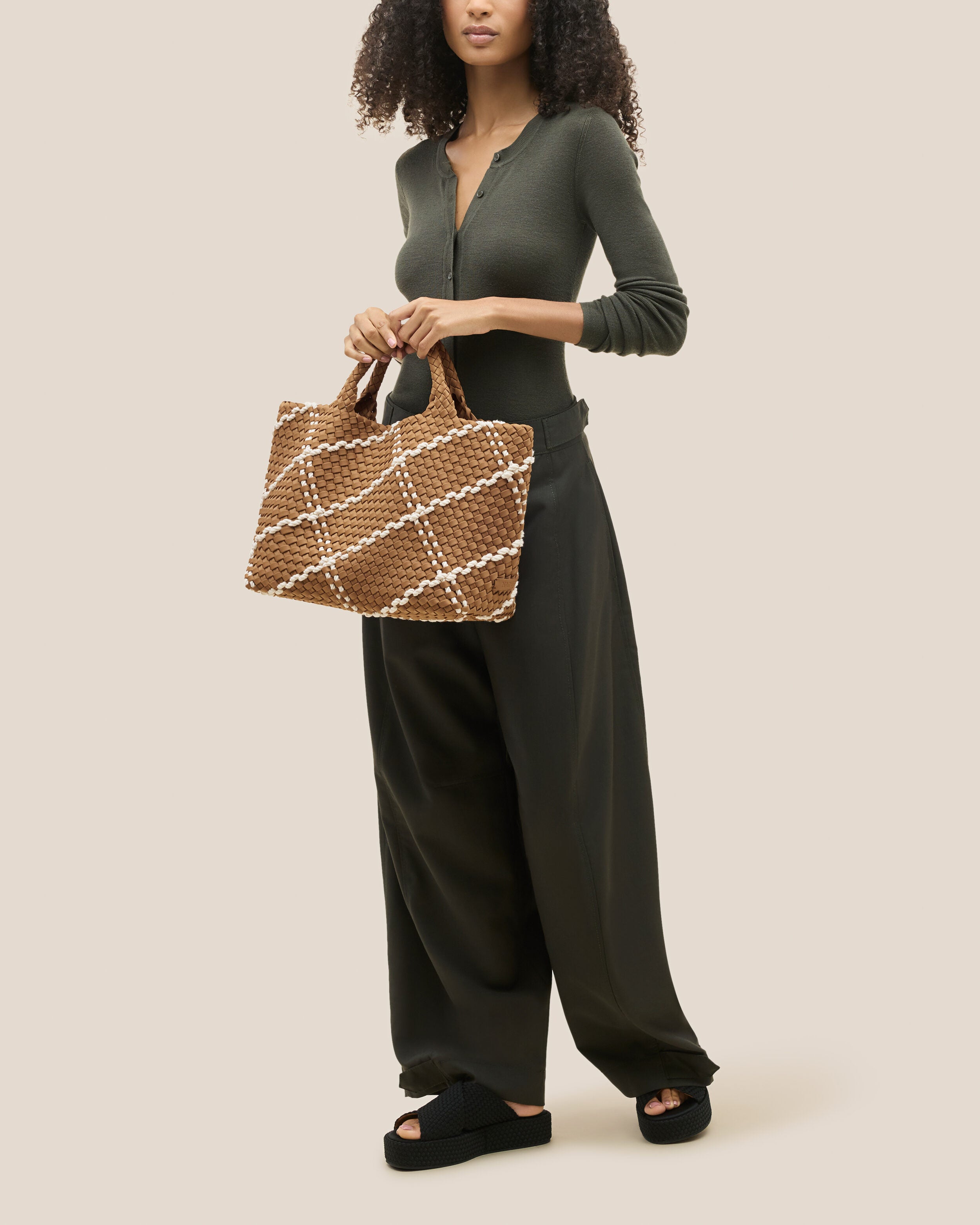 St. Barths Tote in Cove shown on model to illustrate scale and soft silhouette.