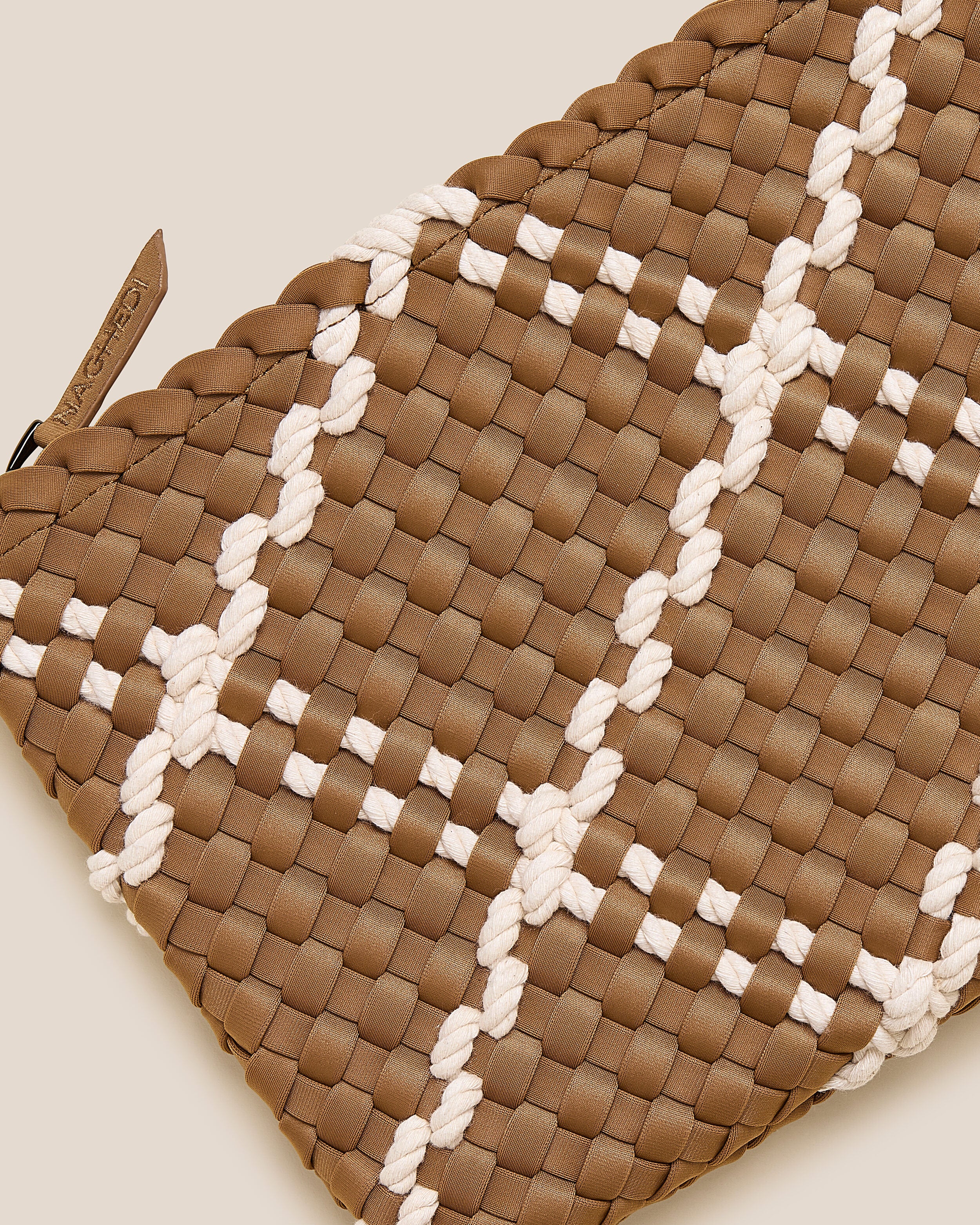 Close-up of included matching woven zippered pouch.