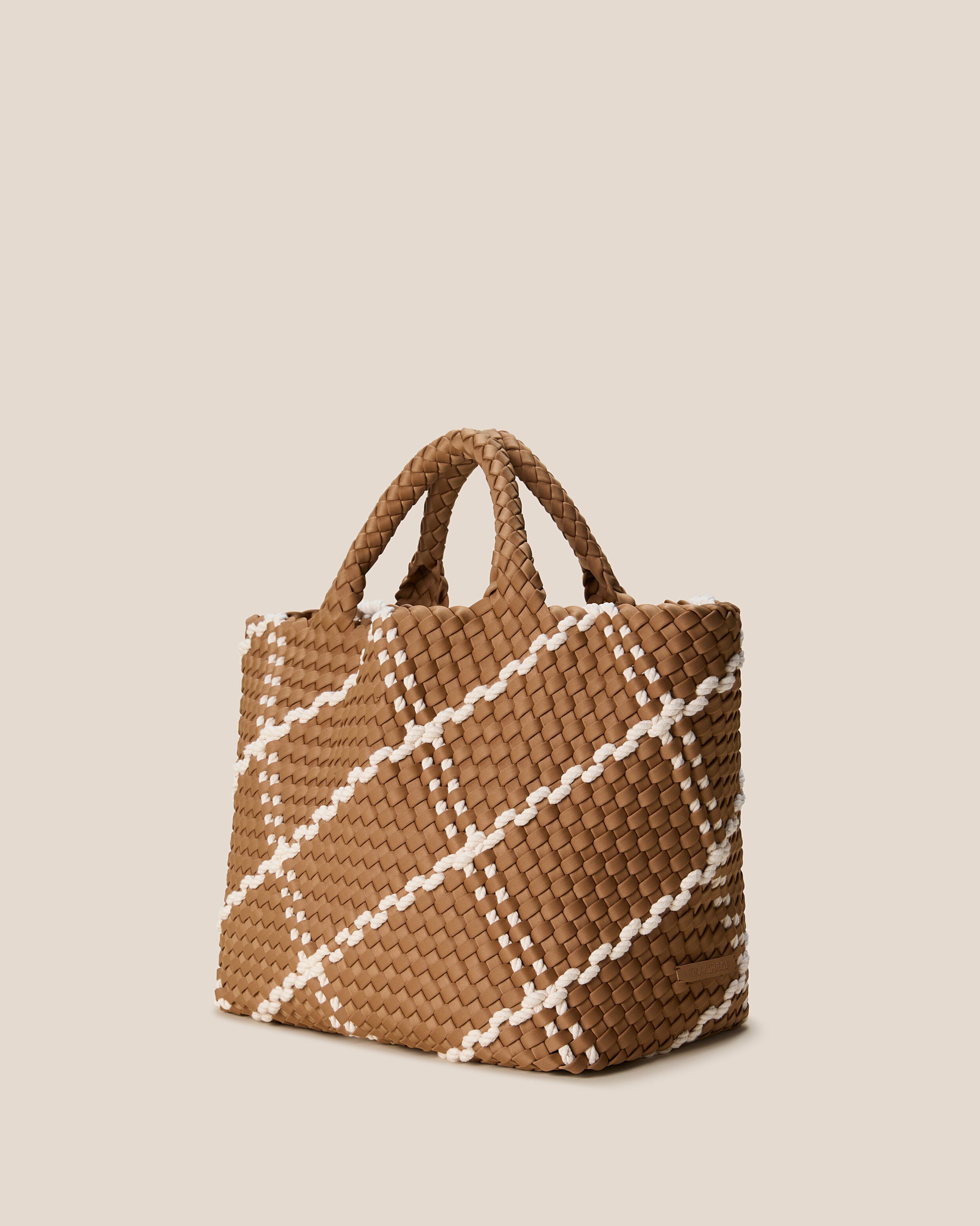 St. Barths Tote in Cove shown from a side angle, highlighting its handwoven neoprene construction and open top.