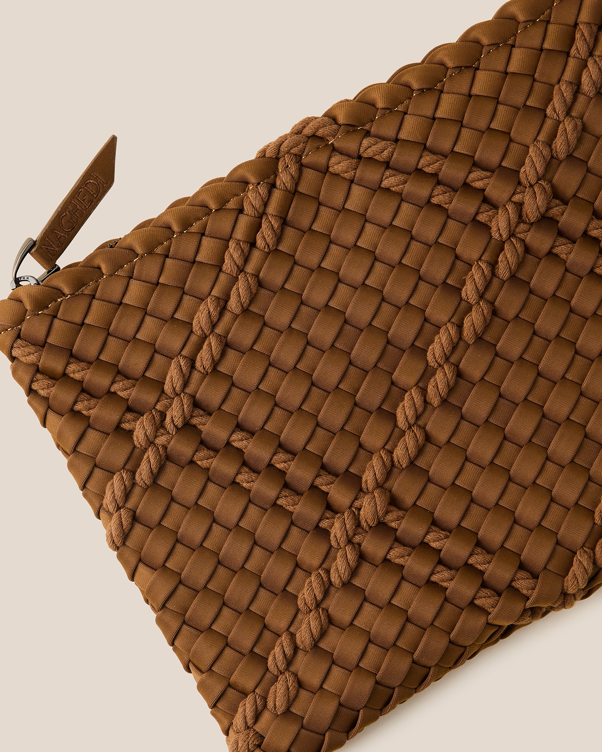 Close-up of included matching woven zippered pouch.