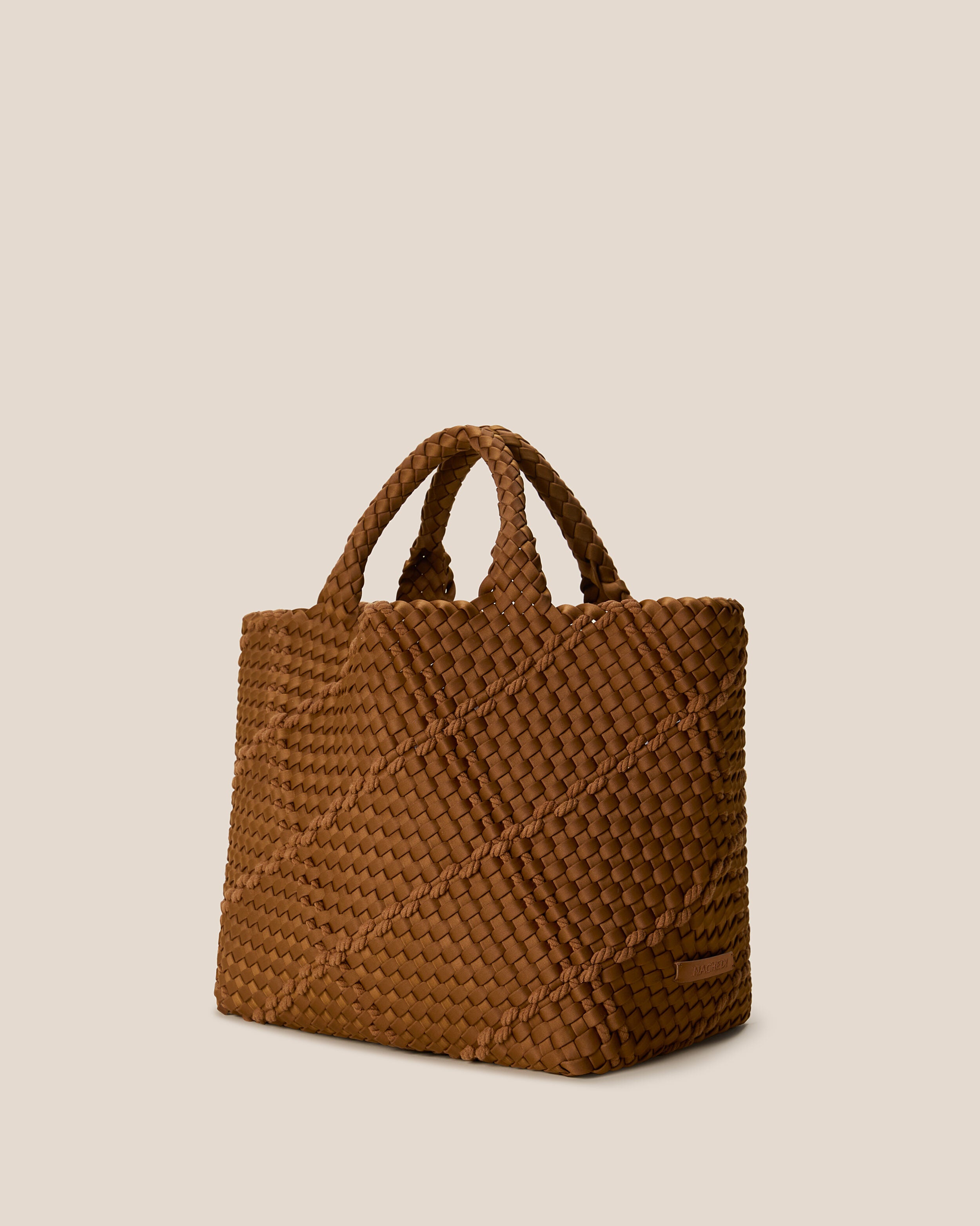 St. Barths Tote in Harbor shown from a side angle, highlighting its handwoven neoprene construction and open top.