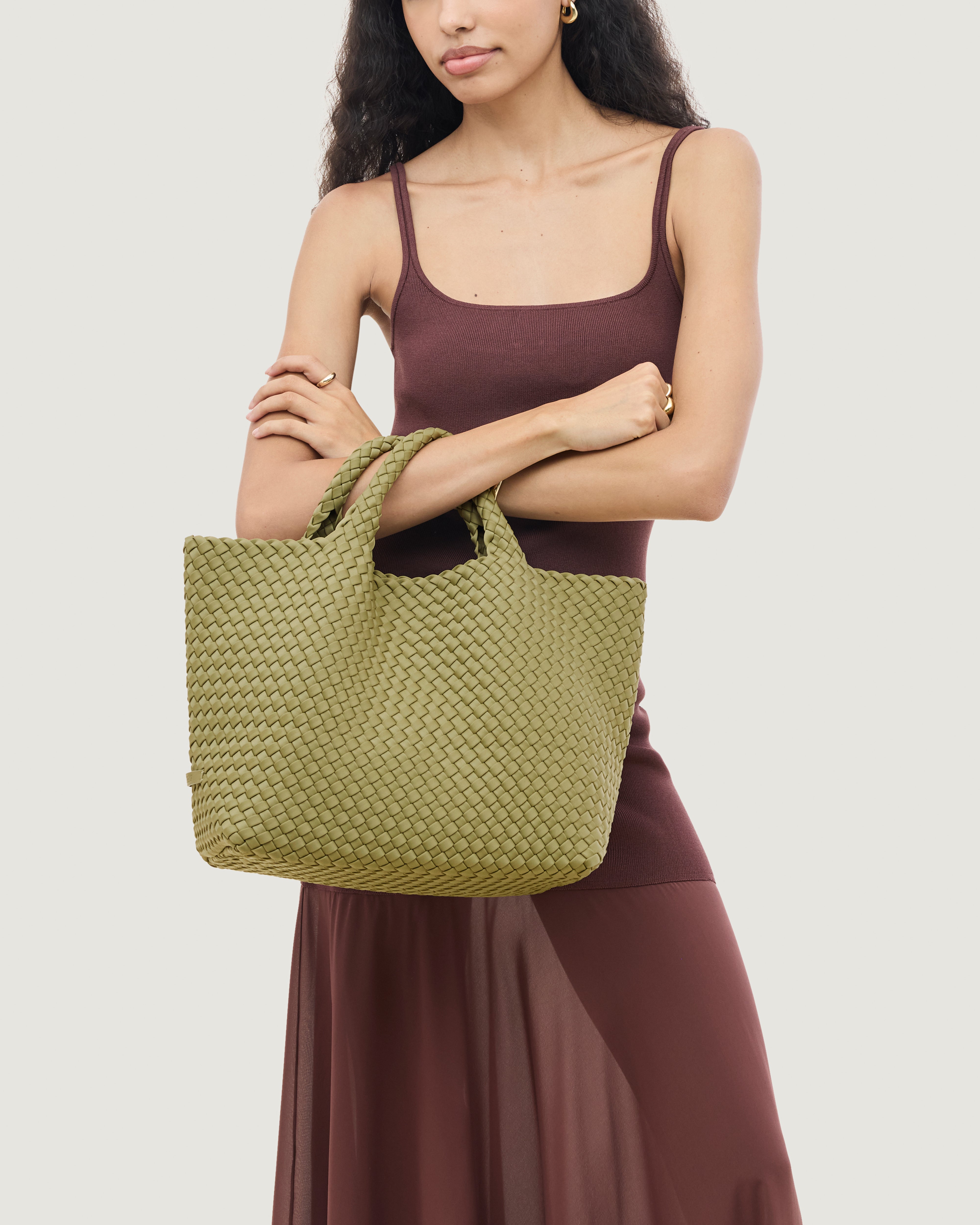 St. Barths Tote in Bottle Green shown on model to illustrate scale and soft silhouette.