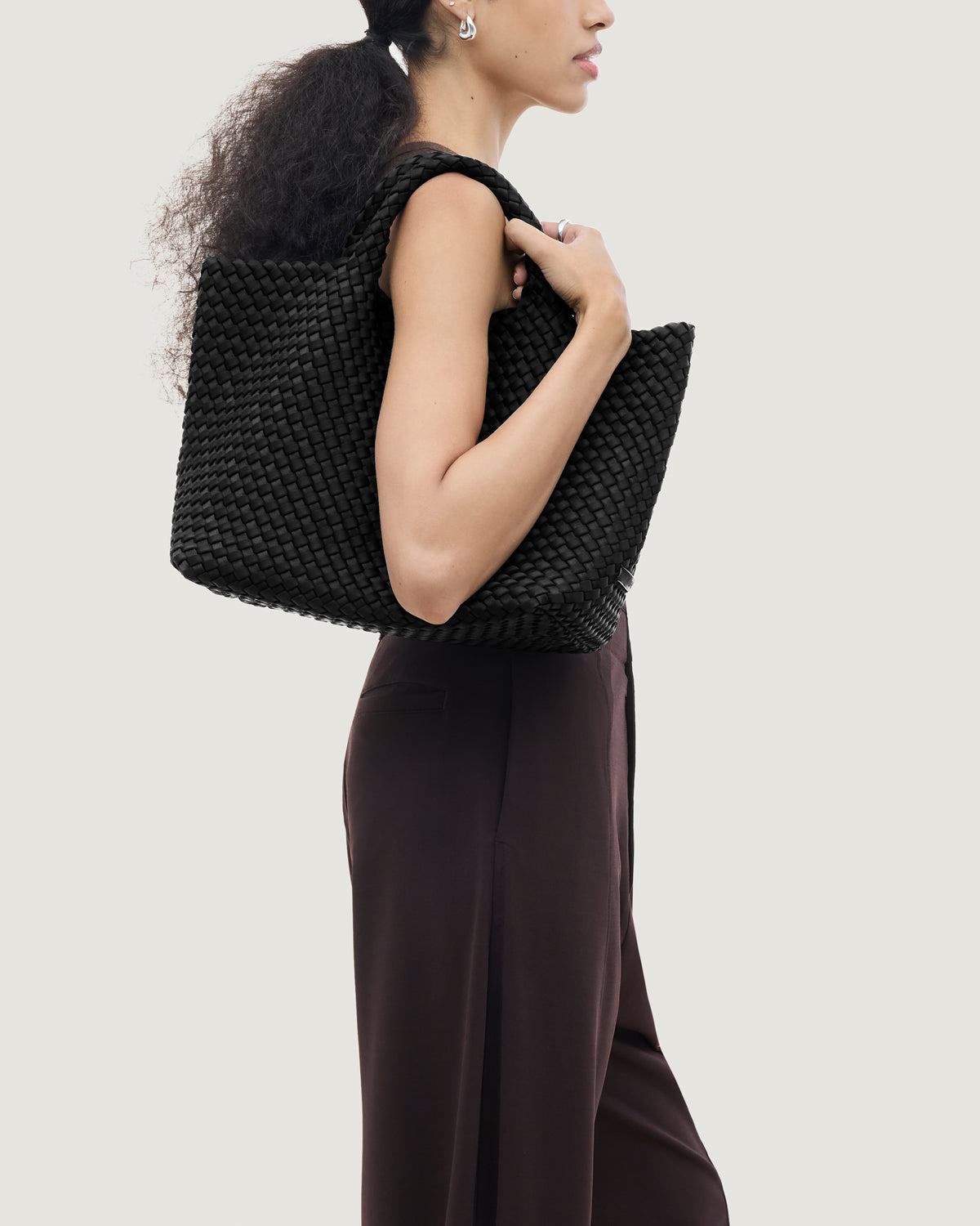 St. Barths Tote in Onyx shown on model to illustrate scale and soft silhouette.