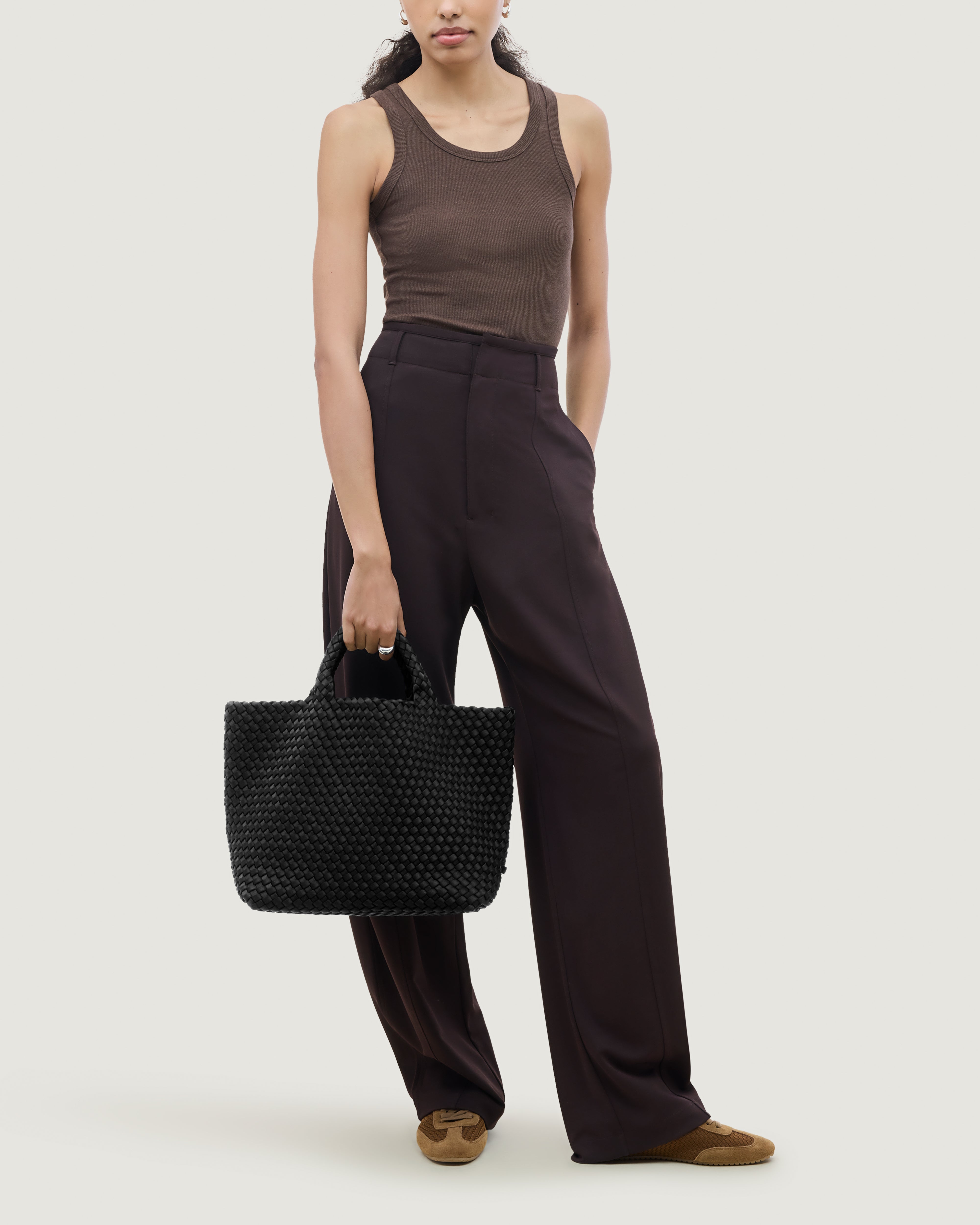 St. Barths Tote in Onyx shown on model to illustrate scale and soft silhouette.