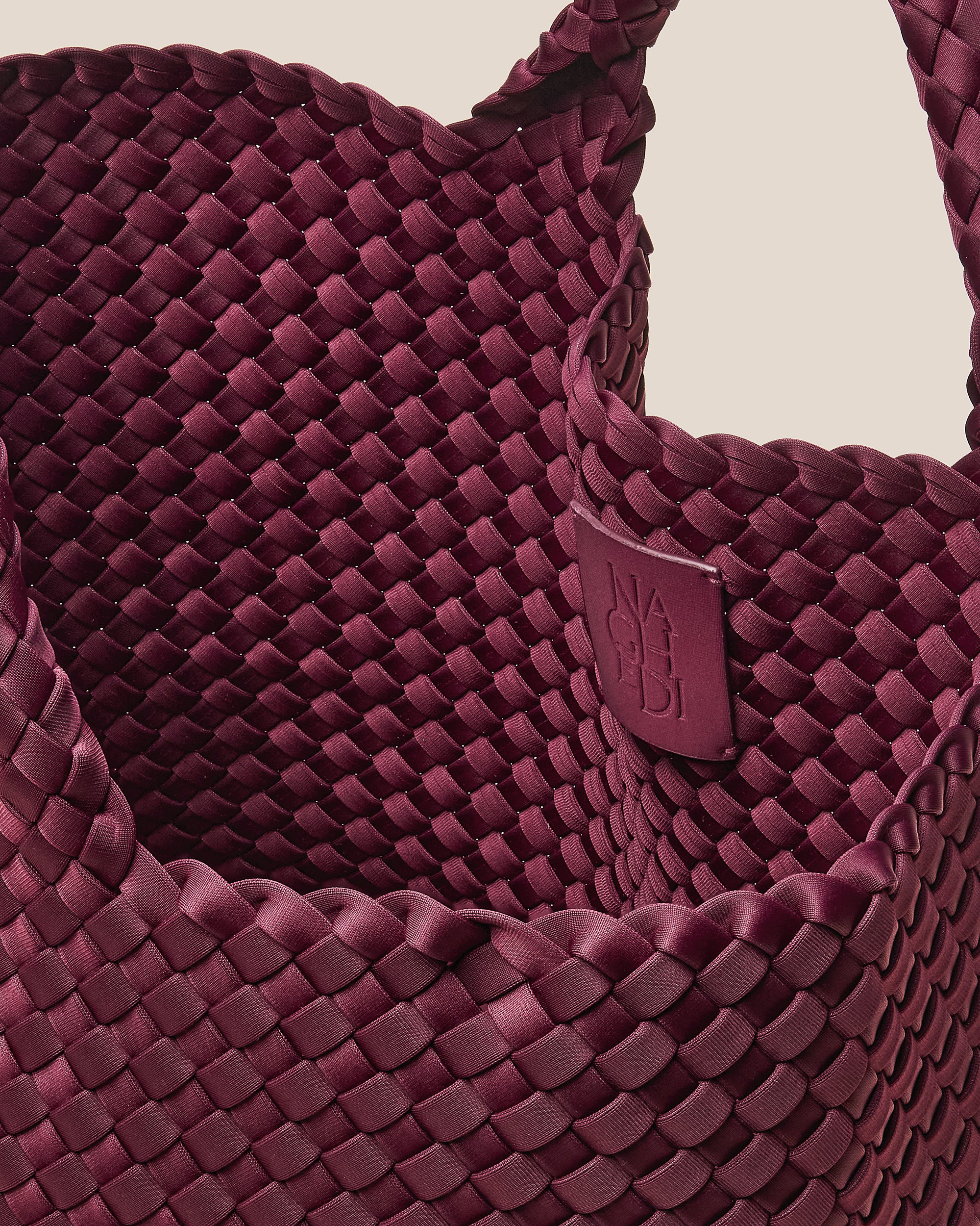 Interior close-up of St. Barths Medium Tote Bag in Bordeaux showing its open top, and unlined interior.