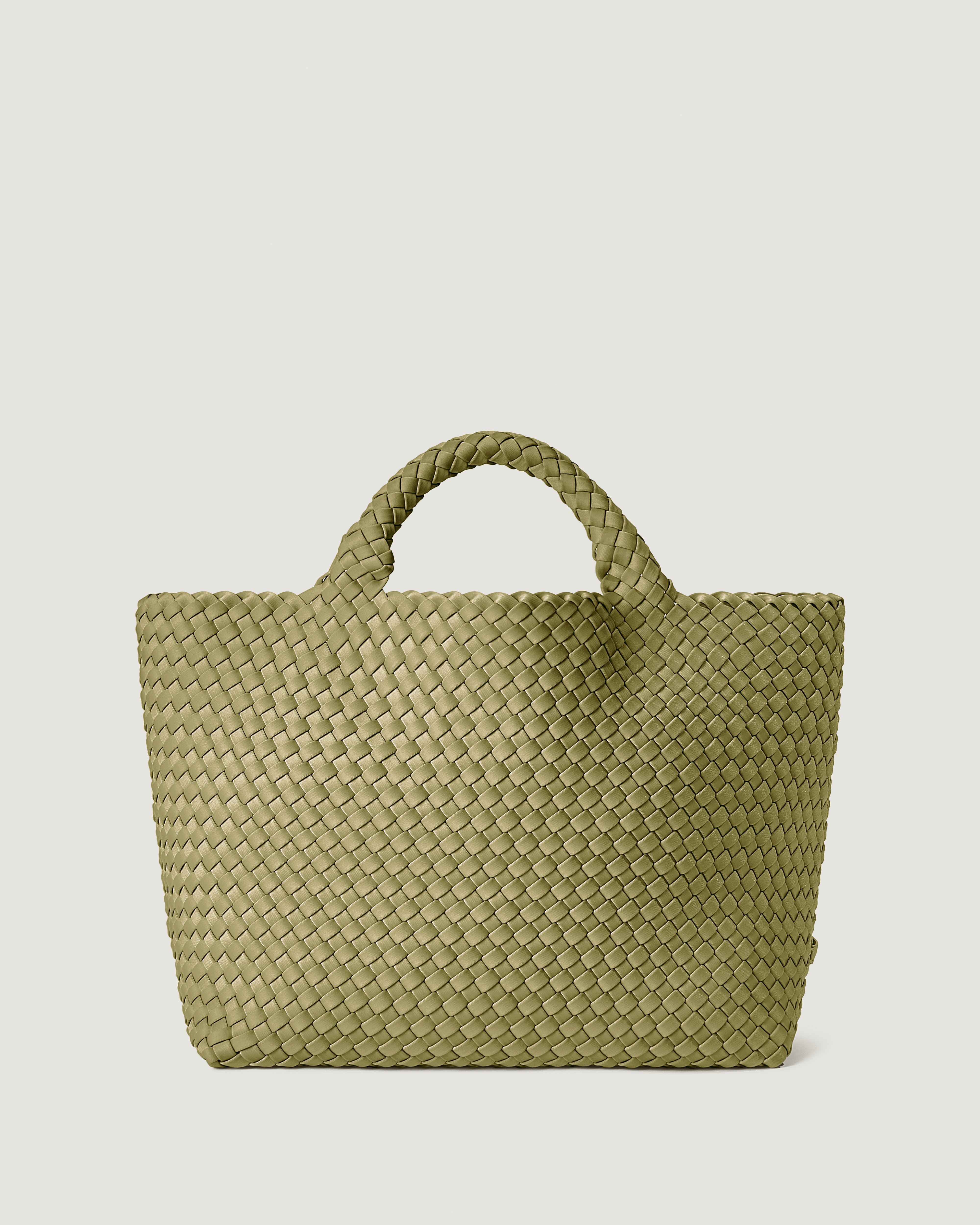 St. Barths Tote in Bottle Green, handwoven in muted green neoprene. Featuring an open top, and woven top handles.