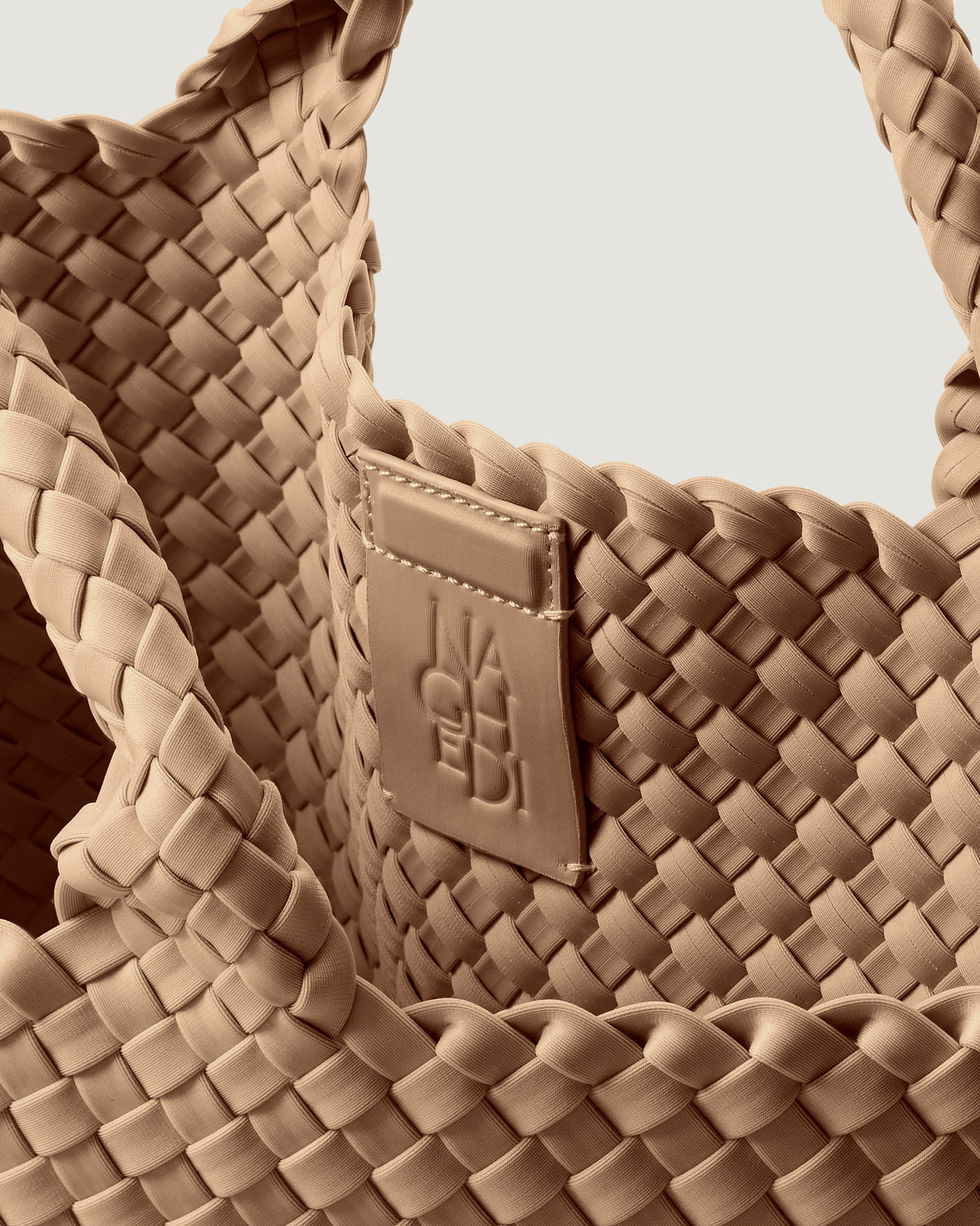 Interior close-up of St. Barths Tote in Camel showing its magnetic snap closure, and unlined interior.