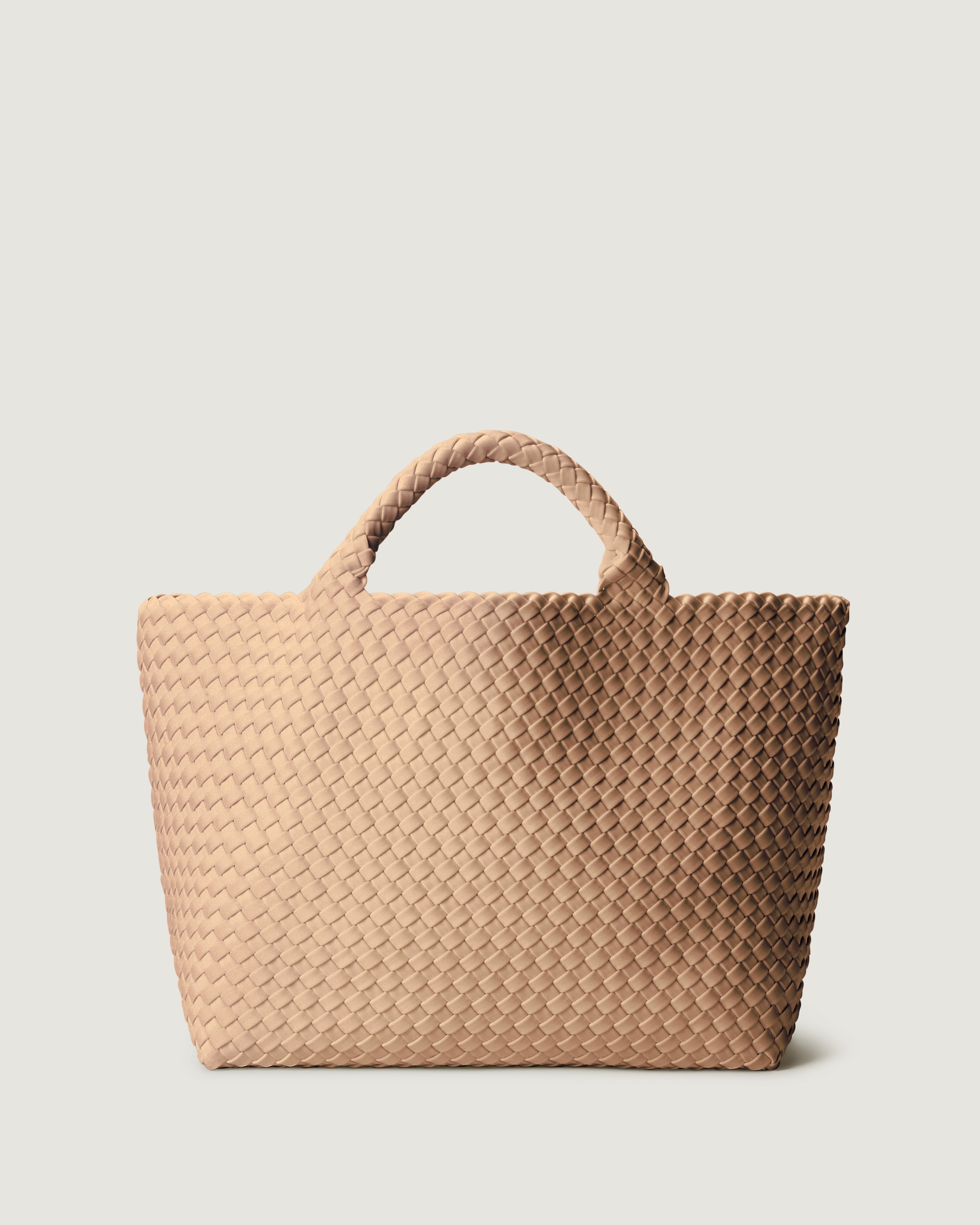 St. Barths Tote in Camel, a camel brown tone, in handwoven neoprene, featuring a magnetic closure, and woven top handles.