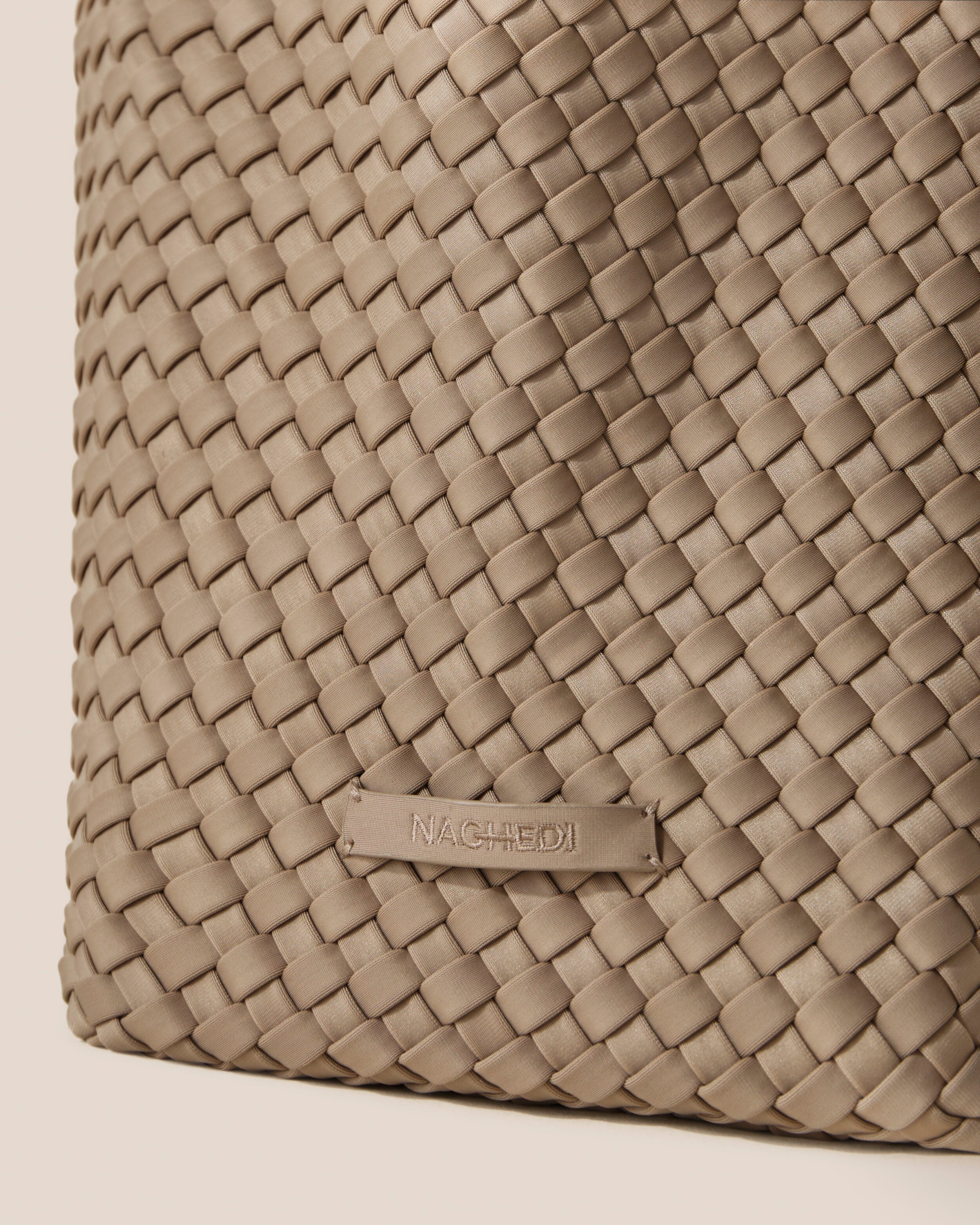 Close-up of stamped NAGHEDI logo on St. Barths Tote in Cashmere.