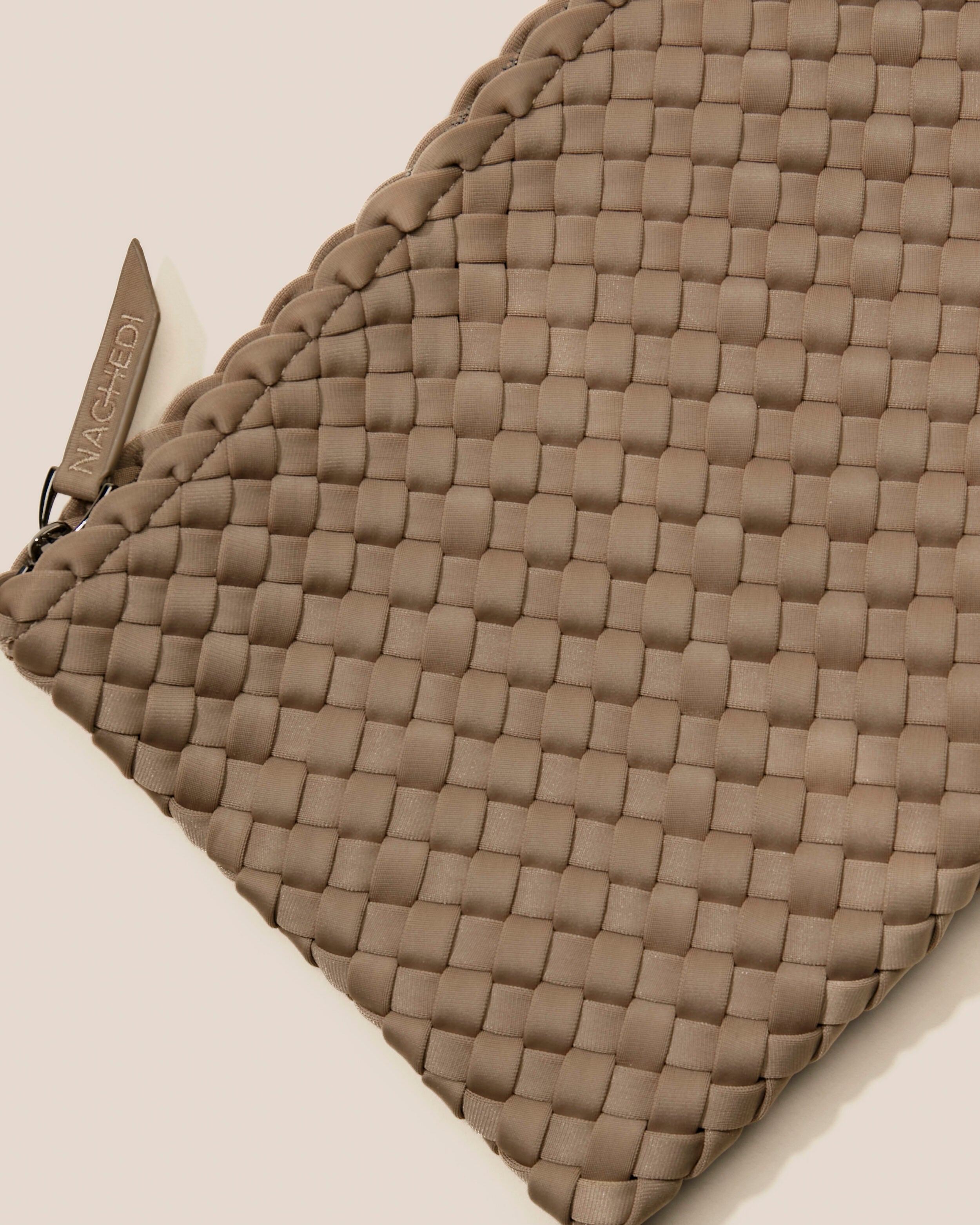 Close-up of included matching woven zippered pouch.