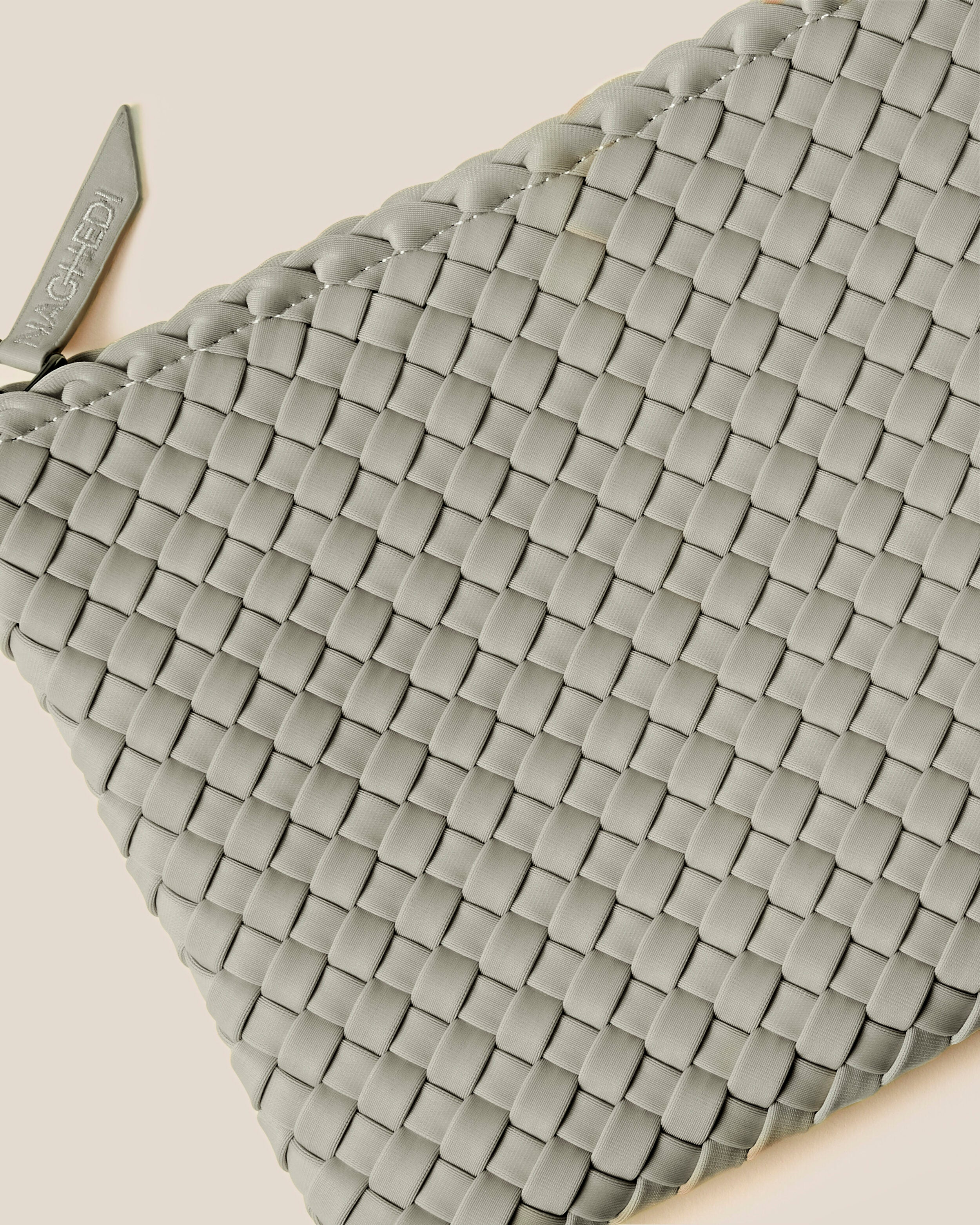 Close-up of included matching woven zippered pouch.