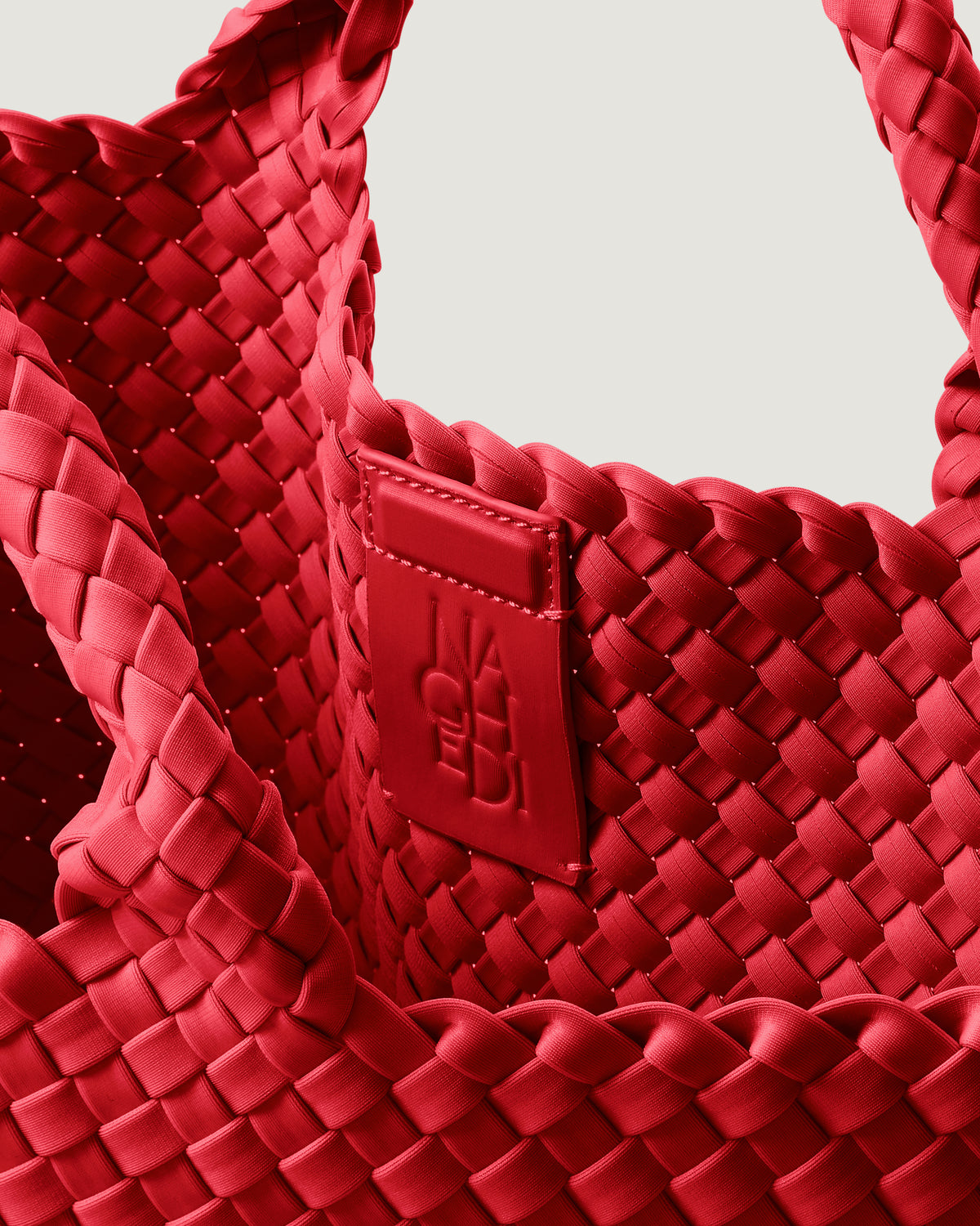 Interior close-up of St. Barths Tote in Cerise showing its magnetic snap closure, and unlined interior.