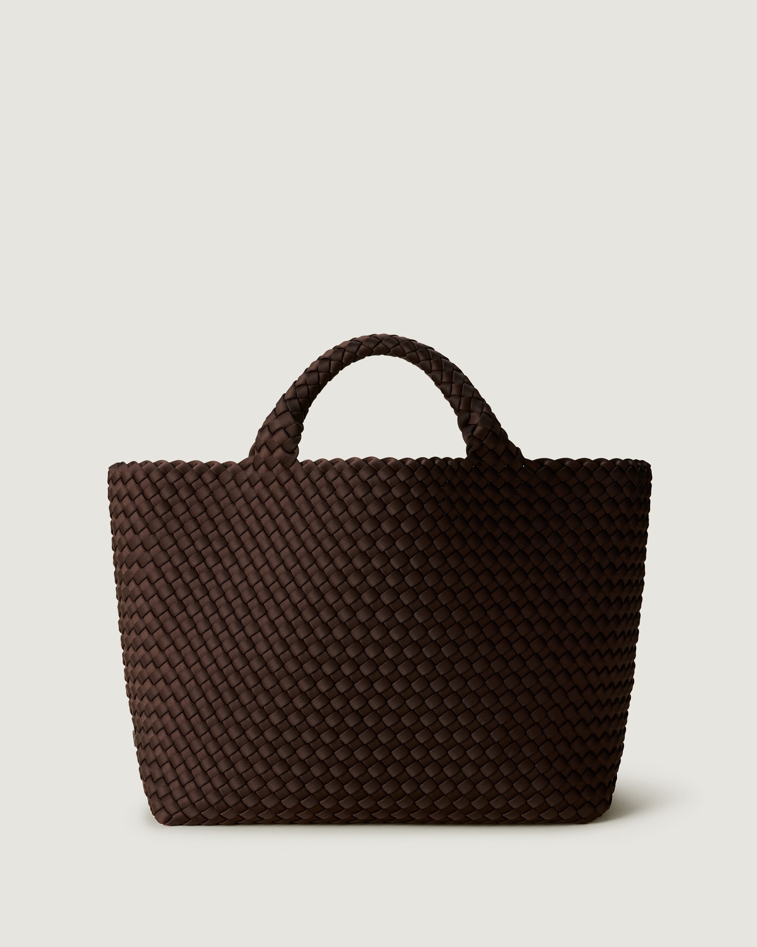 St. Barths Tote in Chocolate, a dark chocolate brown tone, in handwoven neoprene, featuring an open top, and woven top handles.