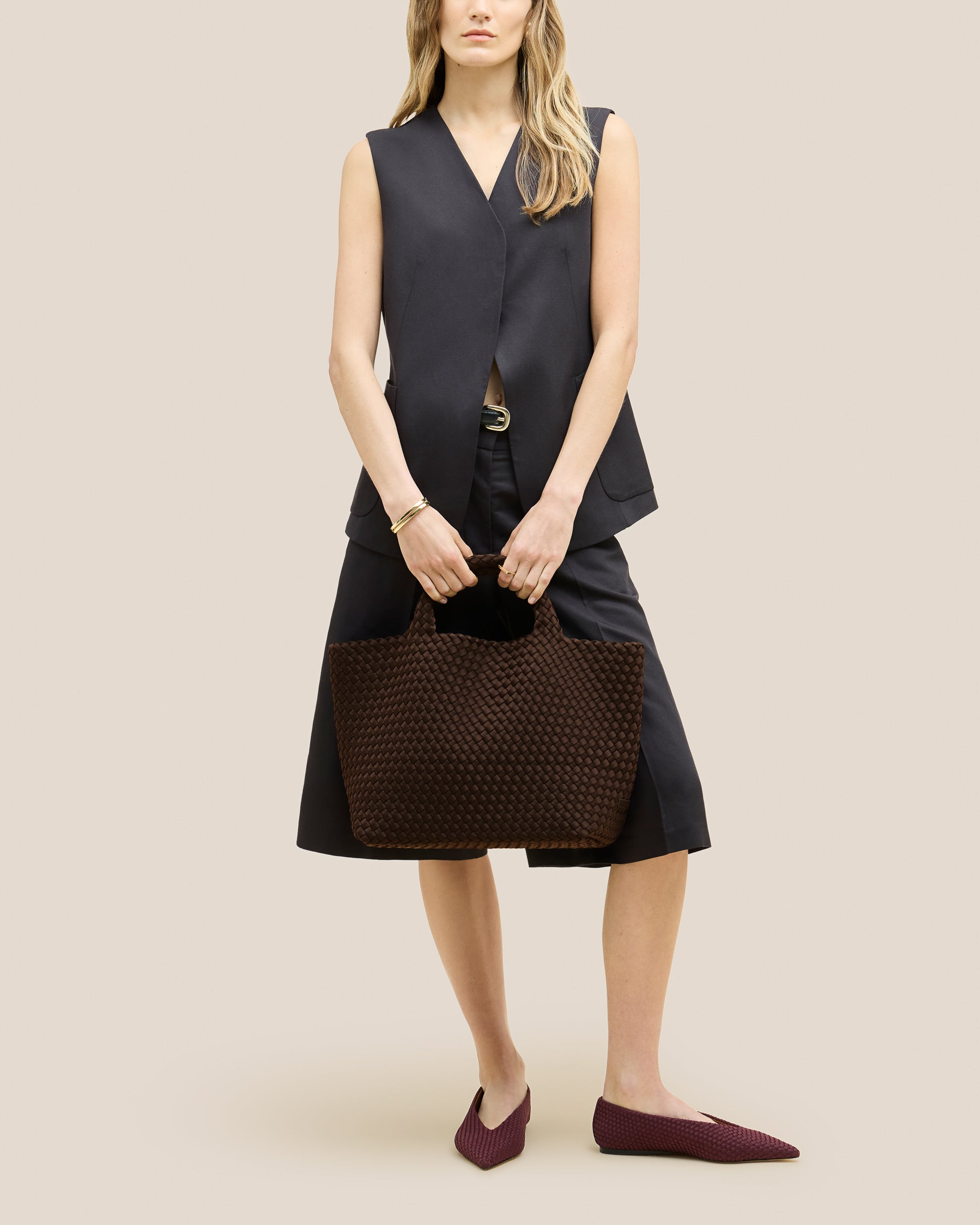 St. Barths Medium Tote Bag in Chocolate shown on model to illustrate scale and soft silhouette.