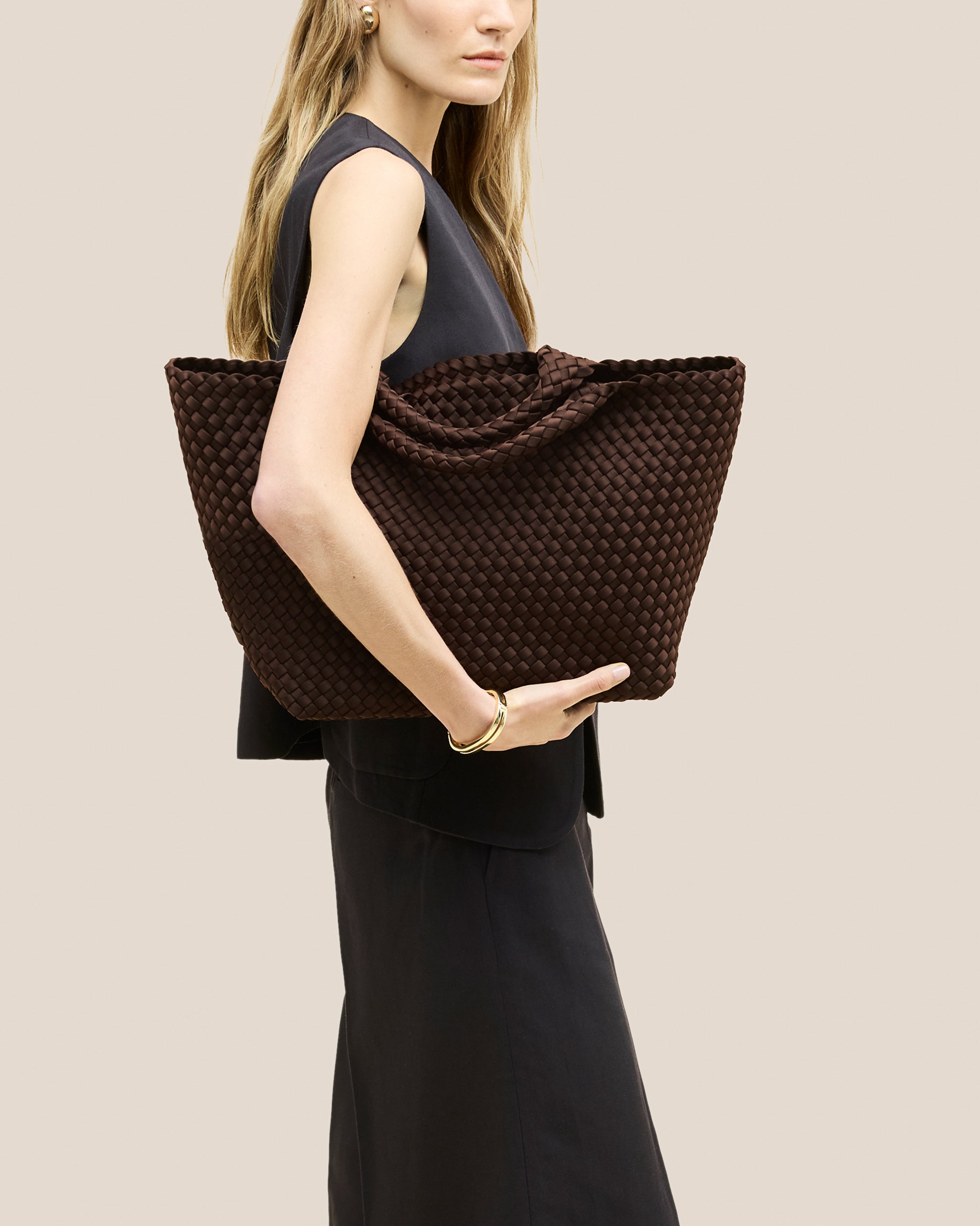 St. Barths Medium Tote Bag in Chocolate shown on model to illustrate scale and soft silhouette.
