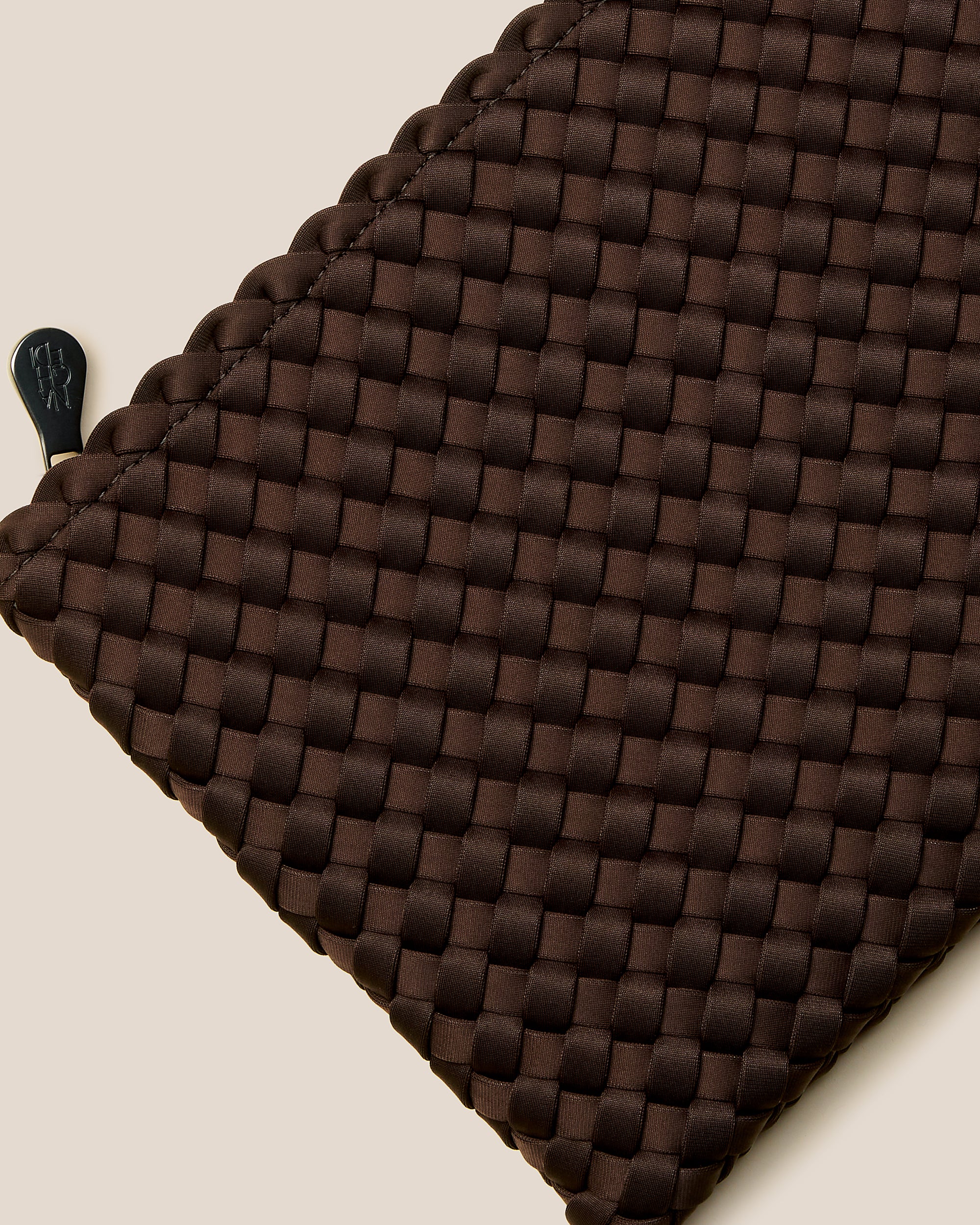 Close-up of included matching woven zippered pouch.
