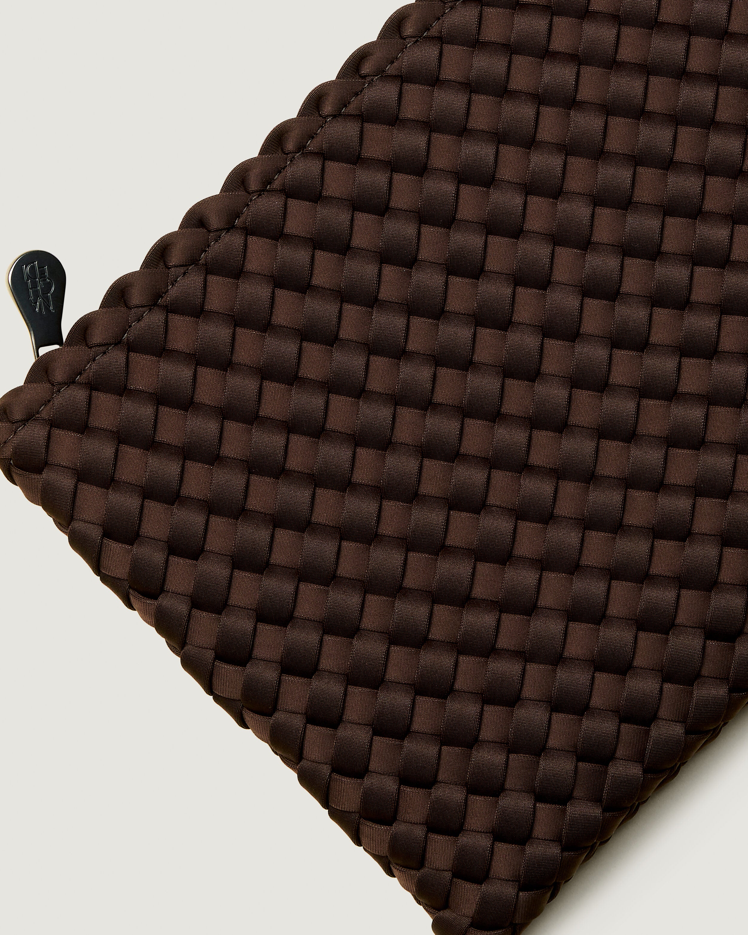 Close-up of included matching woven zippered pouch.