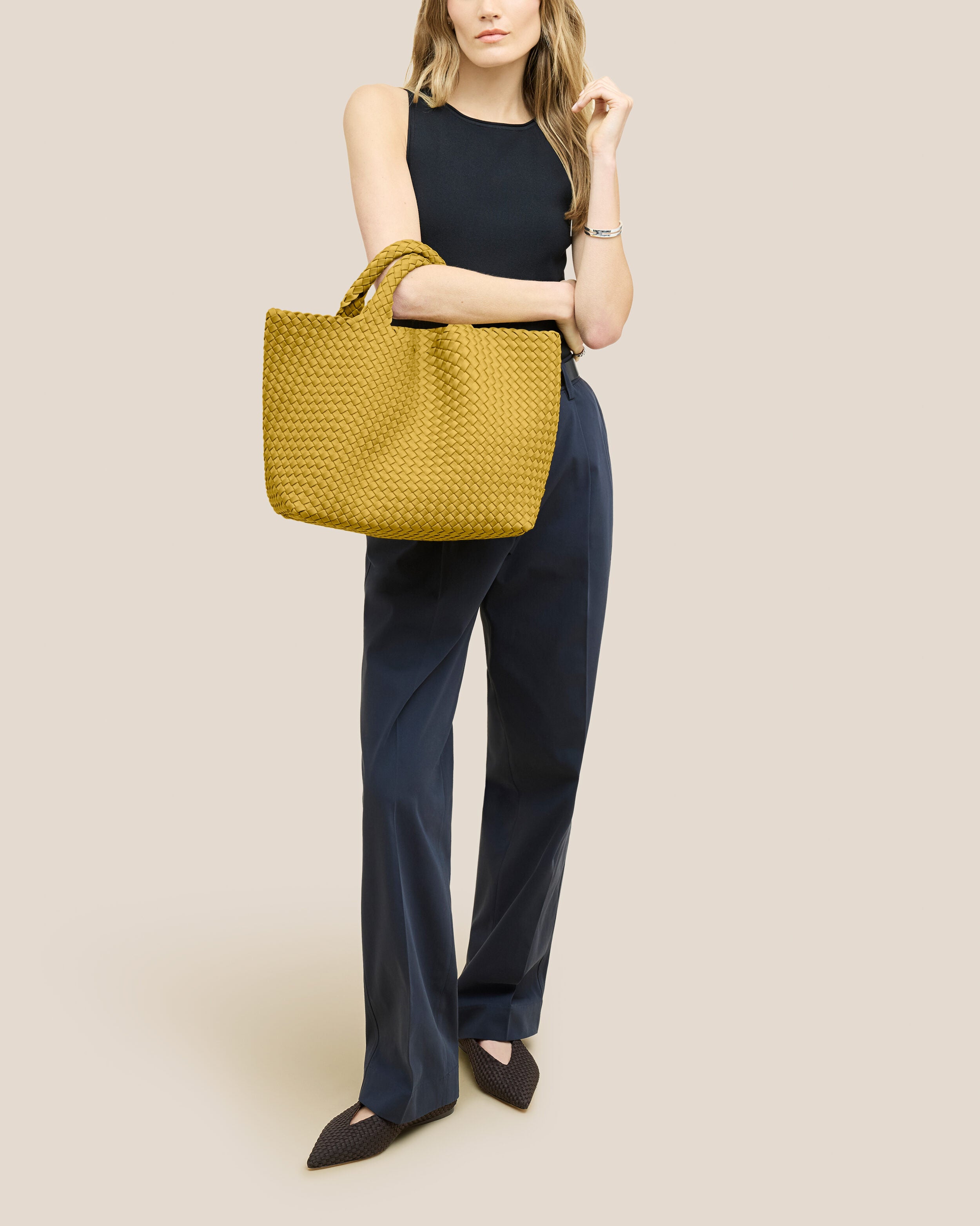 St. Barths Tote in Citrine shown on model to illustrate scale and soft silhouette.