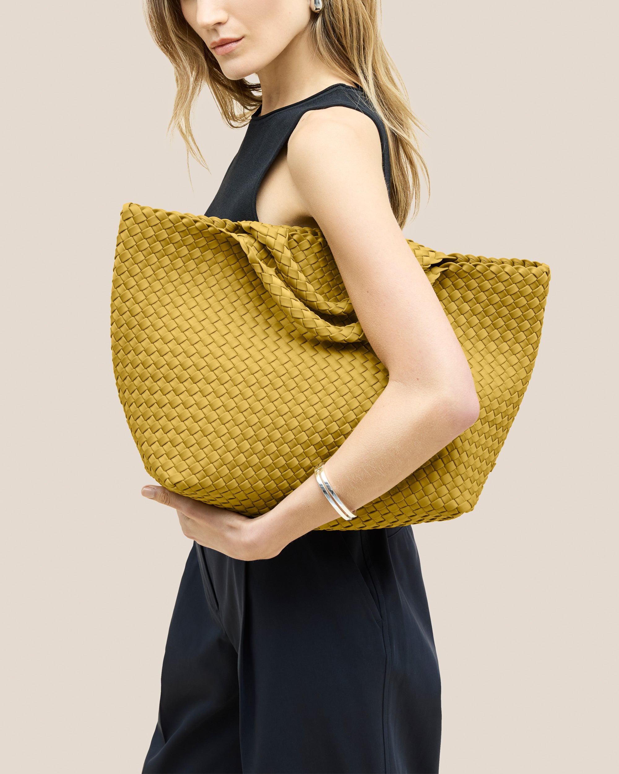 St. Barths Medium Tote Bag in Citrine shown on model to illustrate scale and soft silhouette.