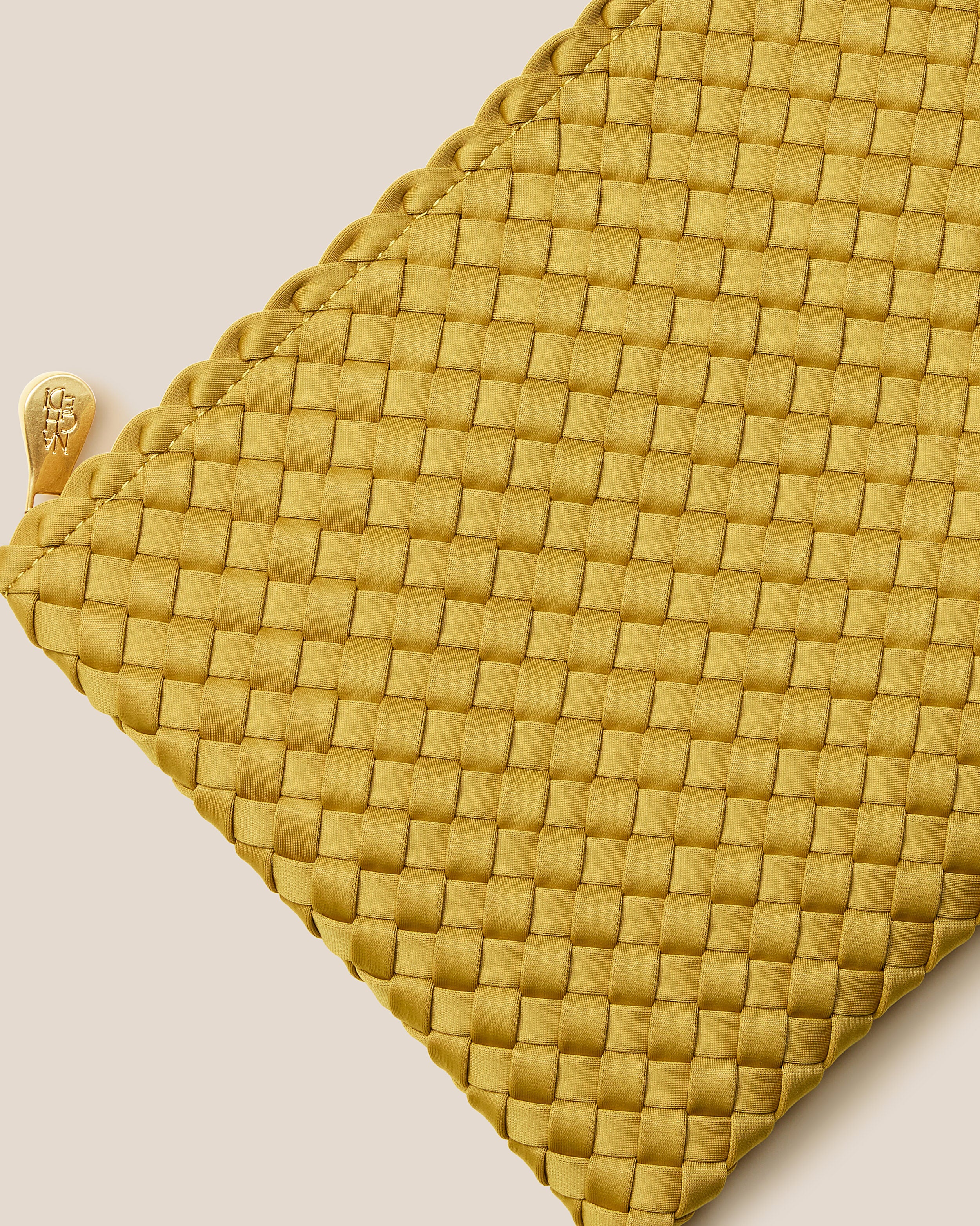 Close-up of included matching woven zippered pouch.